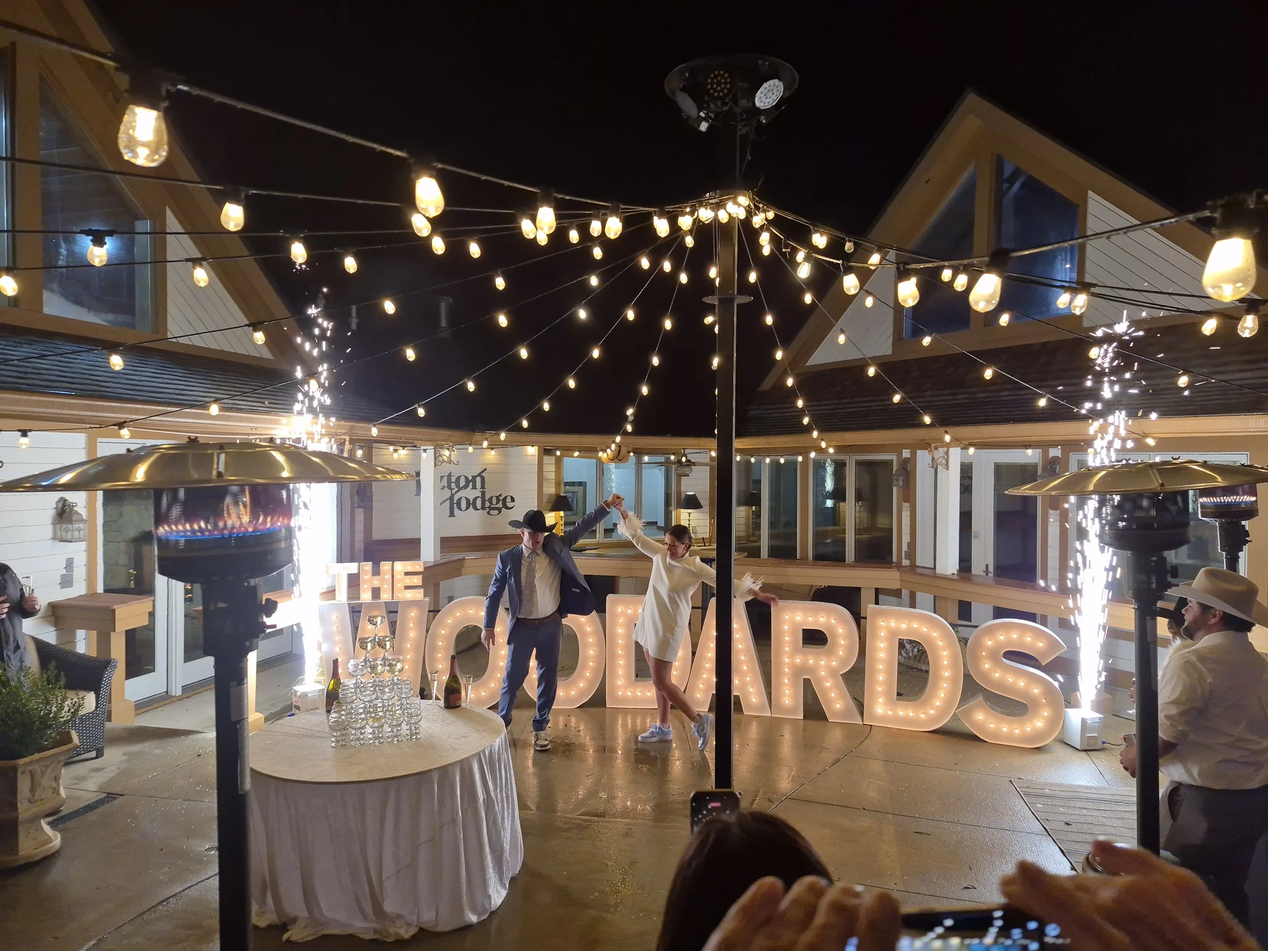 Nighttime outdoor wedding celebration in an Indianapolis courtyard