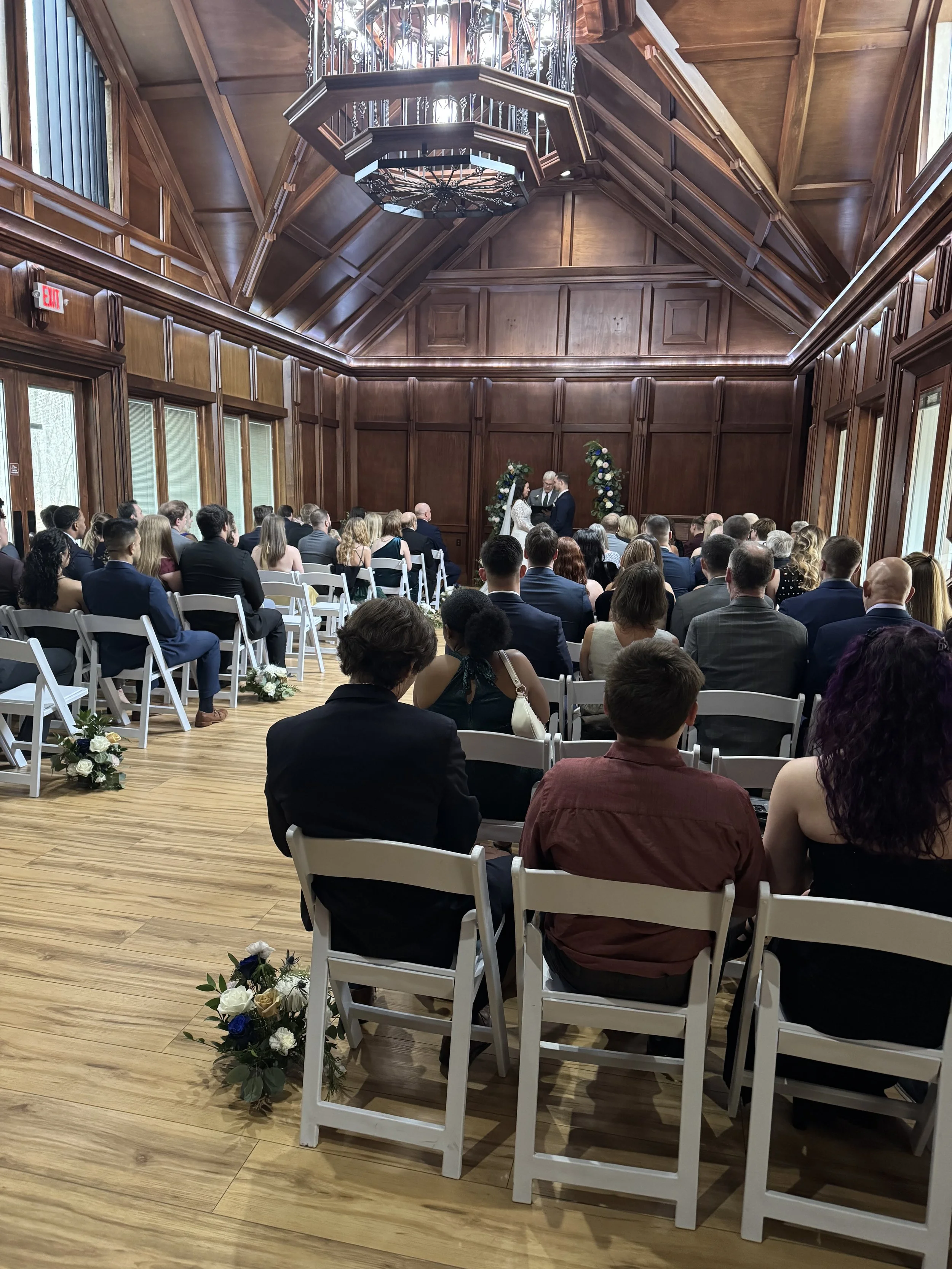 Ceremony in the Ballroom, with wood walls and natural light