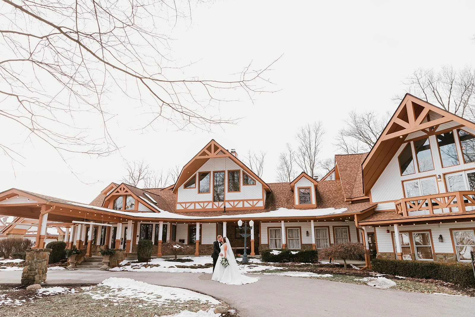 Outdoor Wedding Venue With Couple Outside Taking Wedding Photos