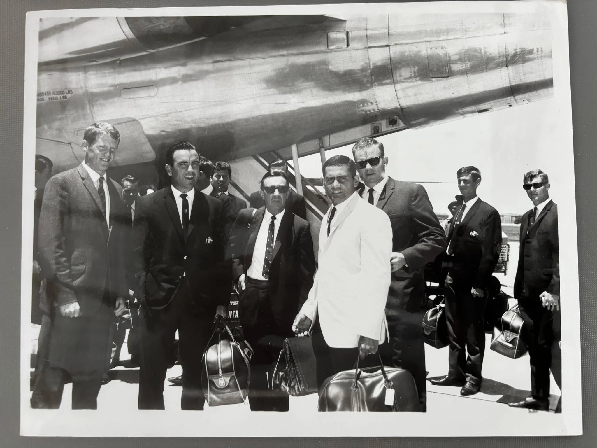 Australian Tour to South Africa 1966/67
Photo from my father's files.
The Australian team arrive in Port Elizabeth and are met by two of the South African greats in brothers Graeme and Peter Pollock.