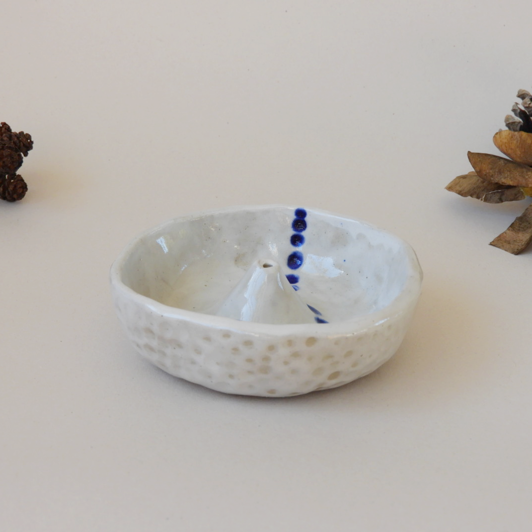 Handmade blue and white ceramic incense holder