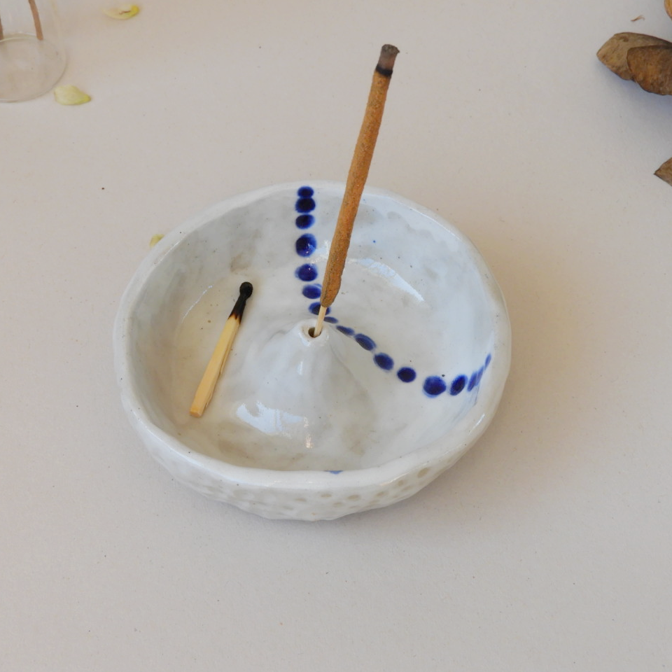 Handmade blue and white ceramic incense holder