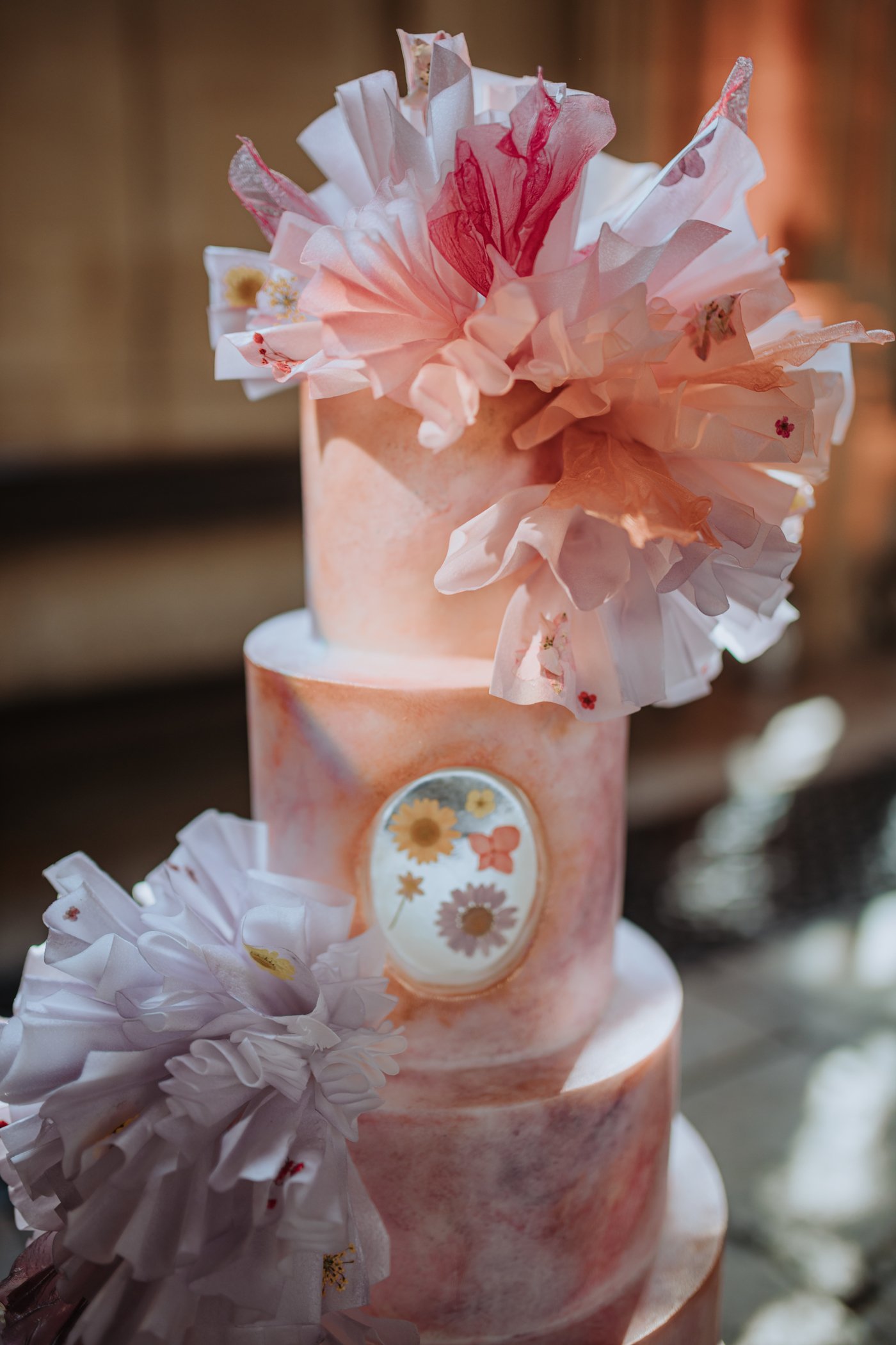 Close up of pastel ruffled wedding cake