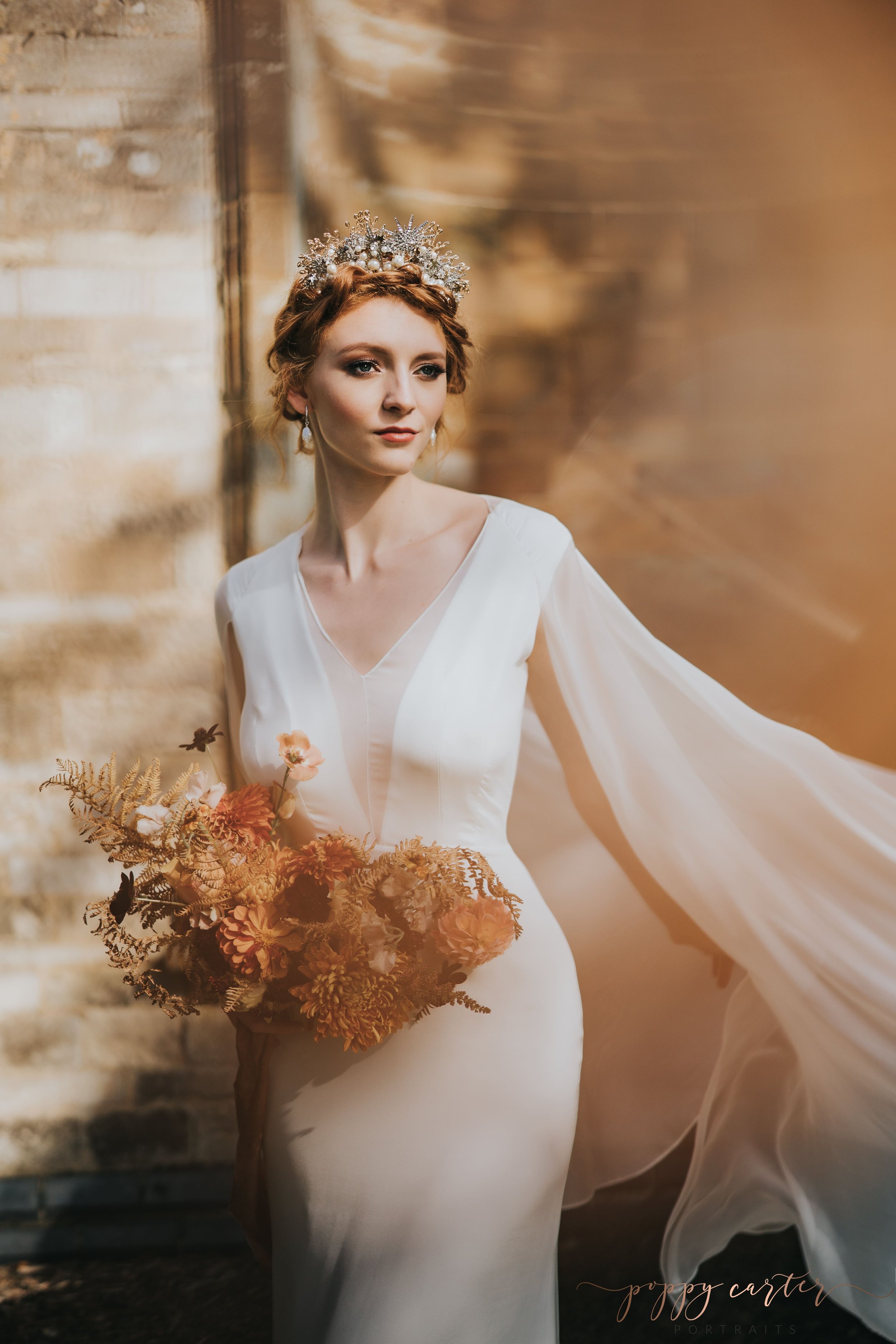 Ethereal bride in white dress and cape