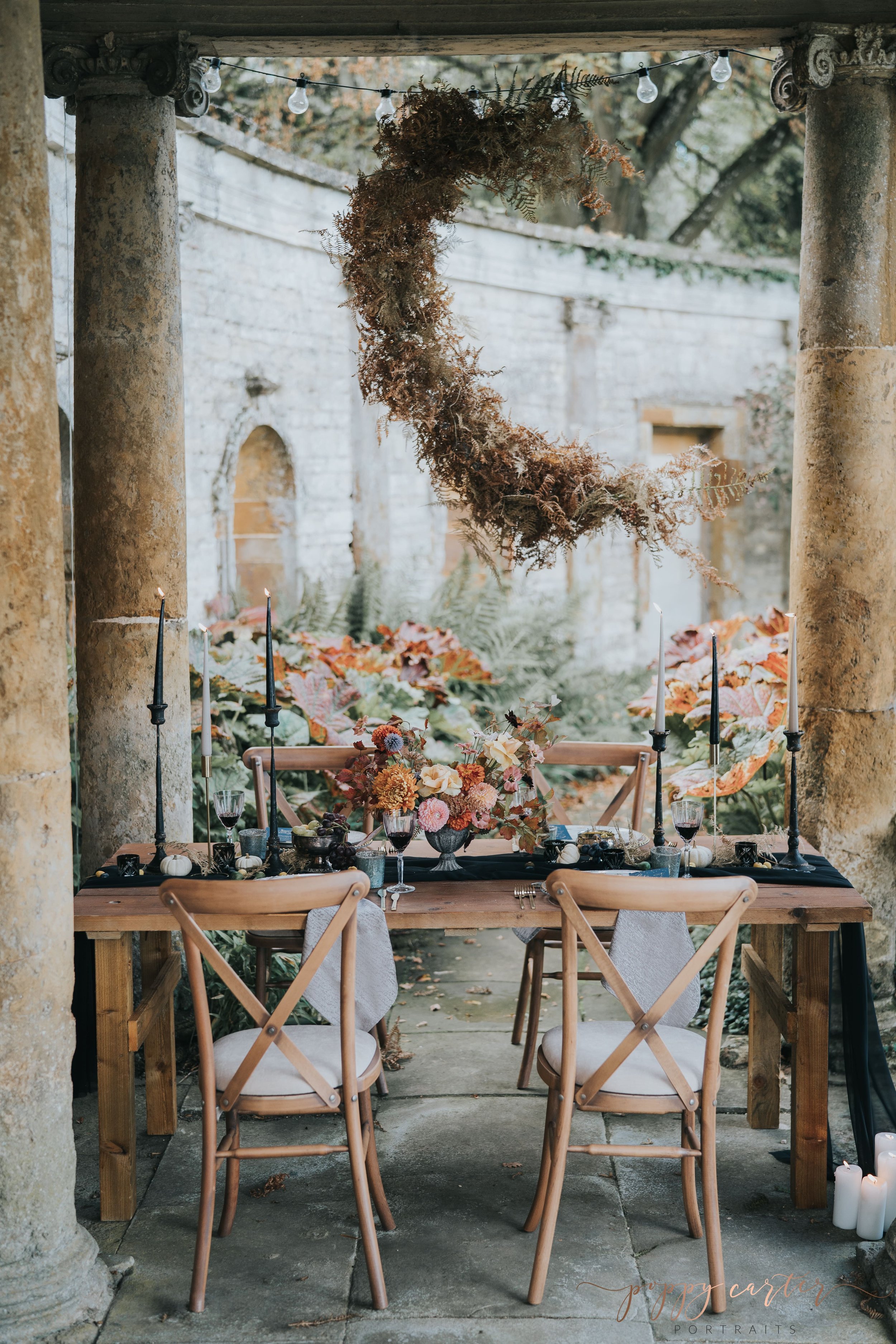 Wedding breakfast table with moon shaped flower instal