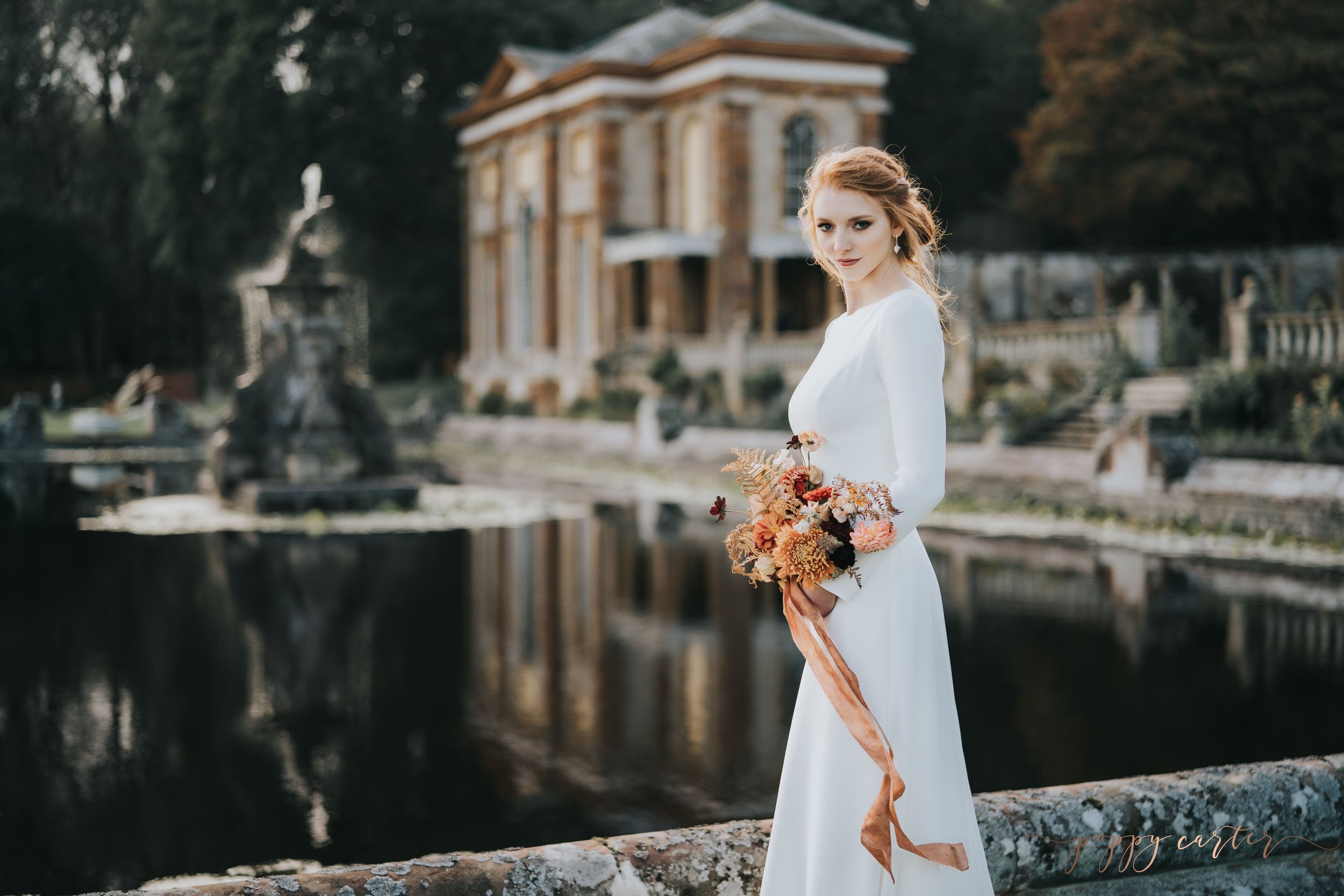 Autumn Bride standing by lake