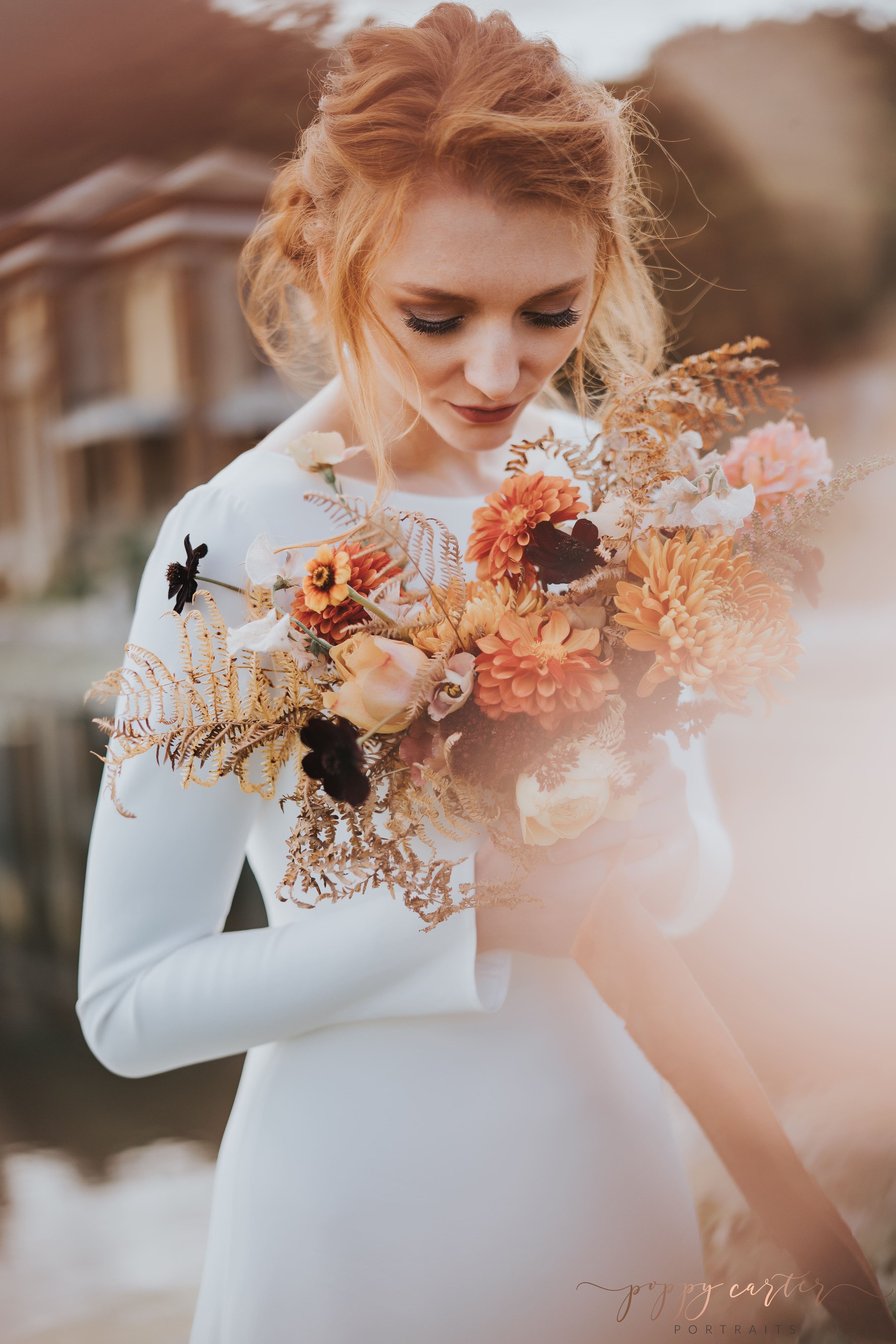 Beautiful autumn bride holding bouquet