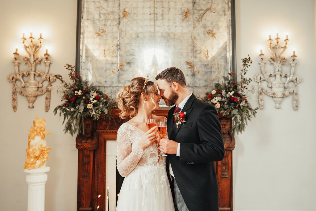 Bride and groom toast at Christmas wedding