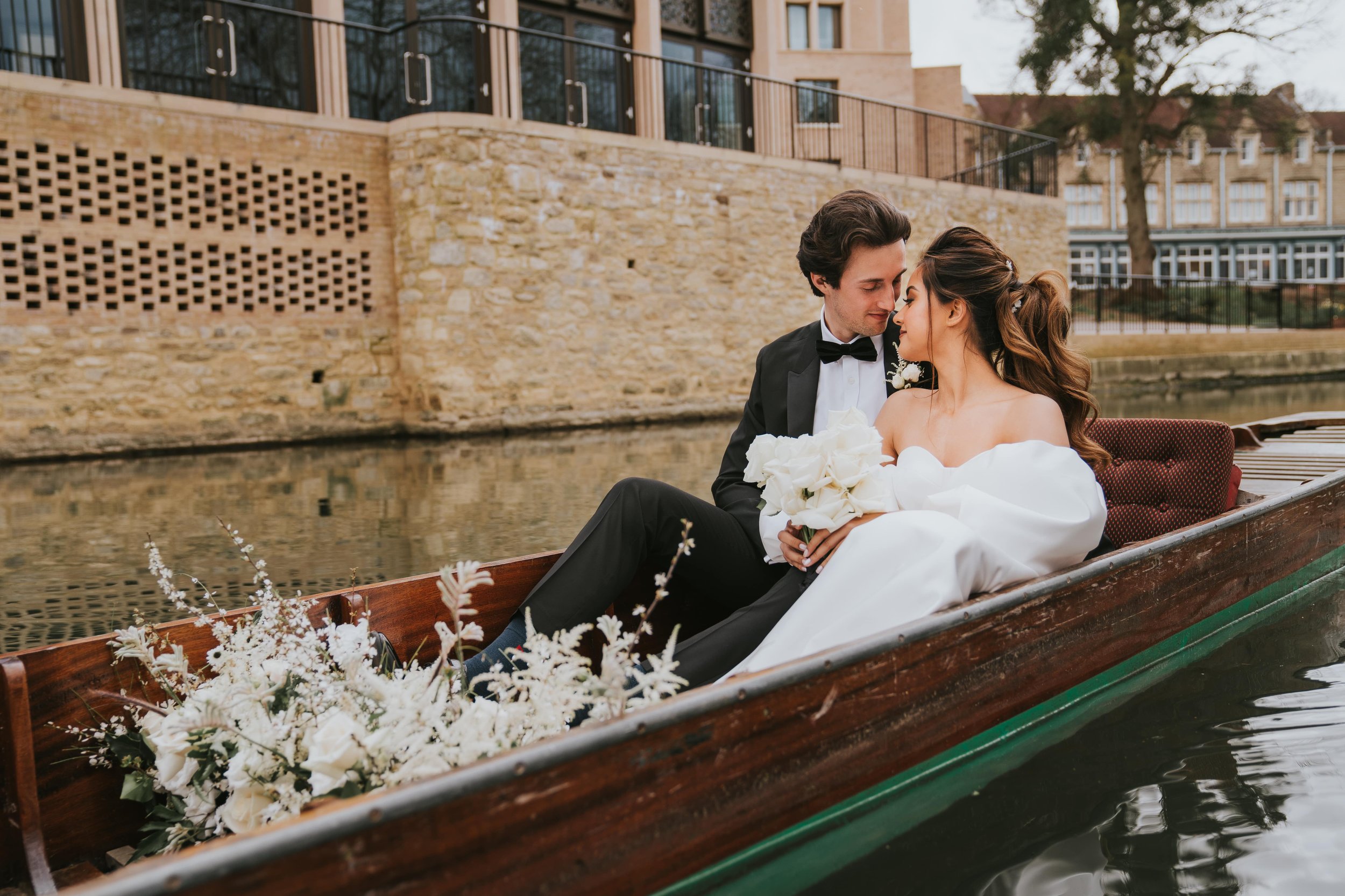 Bride and groom portrait on punting boat