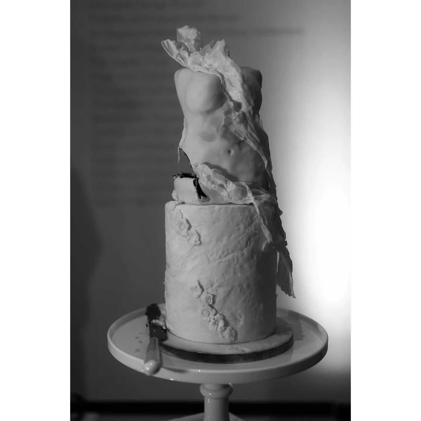 It's not often that I love an image of one of my wedding cakes AFTER it has been cut! That missing chuck looks like it should have been there all along. 

I also love the fact that it's in black and white...it captures the mood and texture of the han