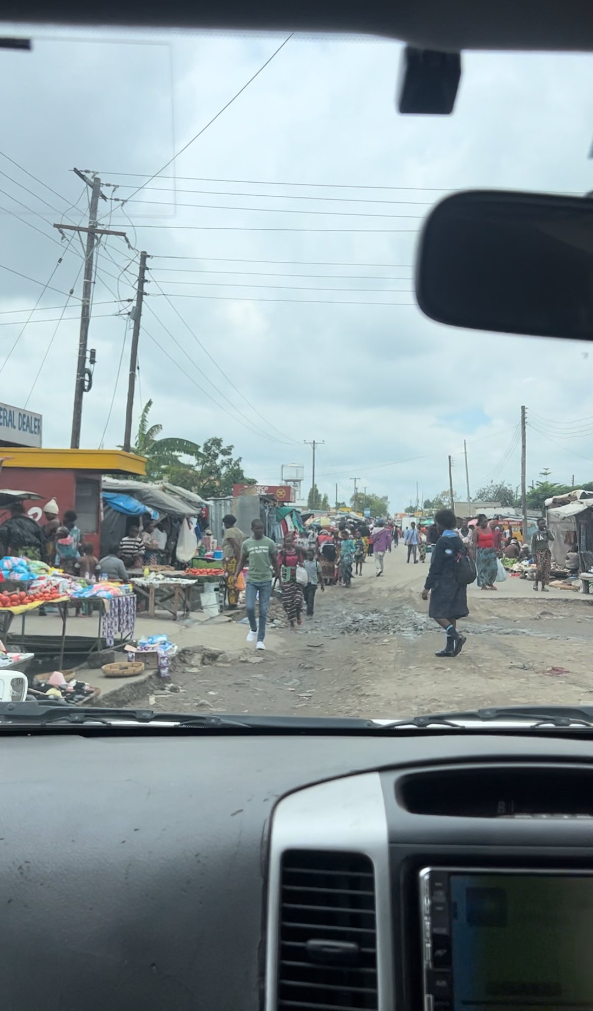 From the car: one of the markets we pass through on the way to school