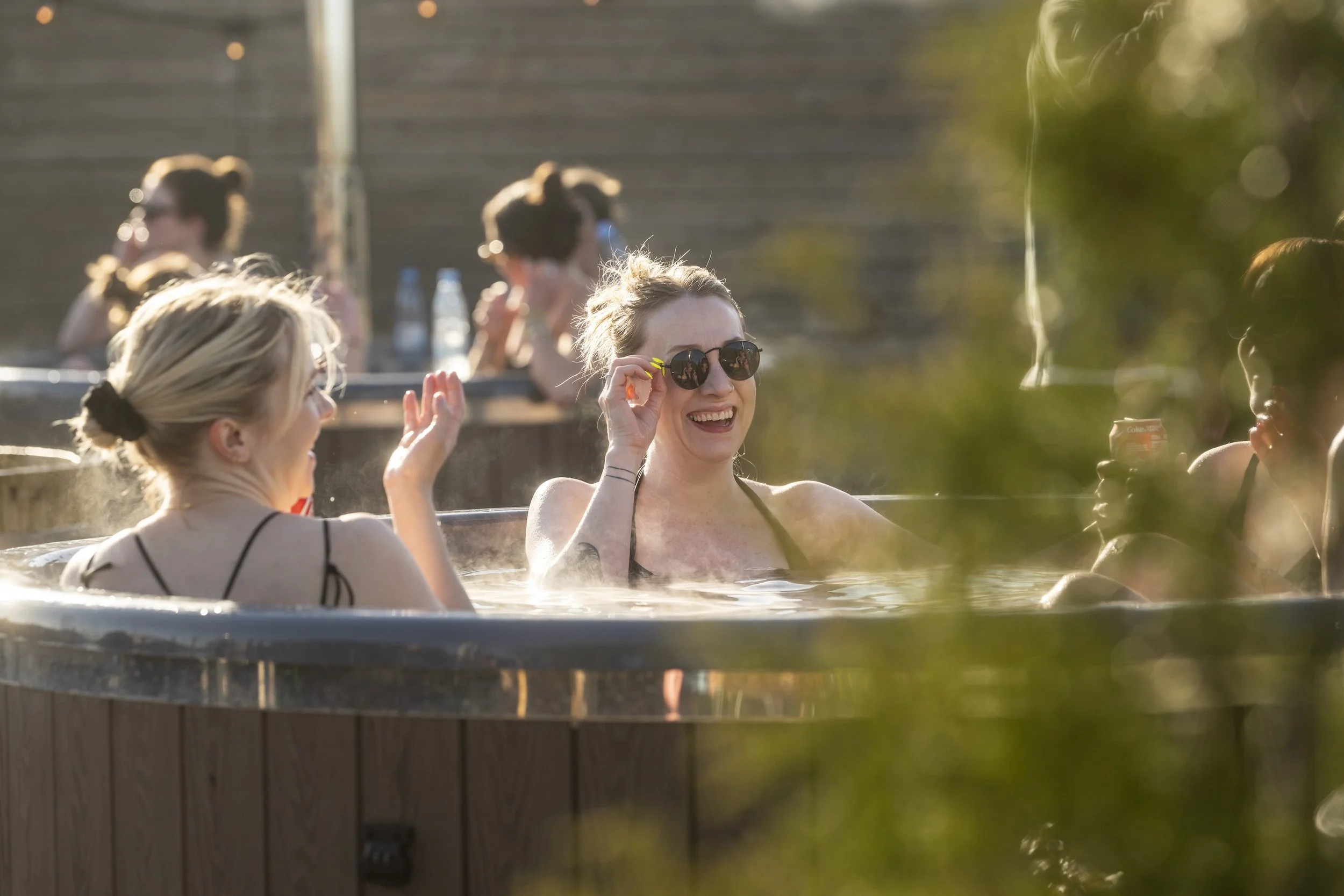People in outdoor Hot tubs enjoying themself