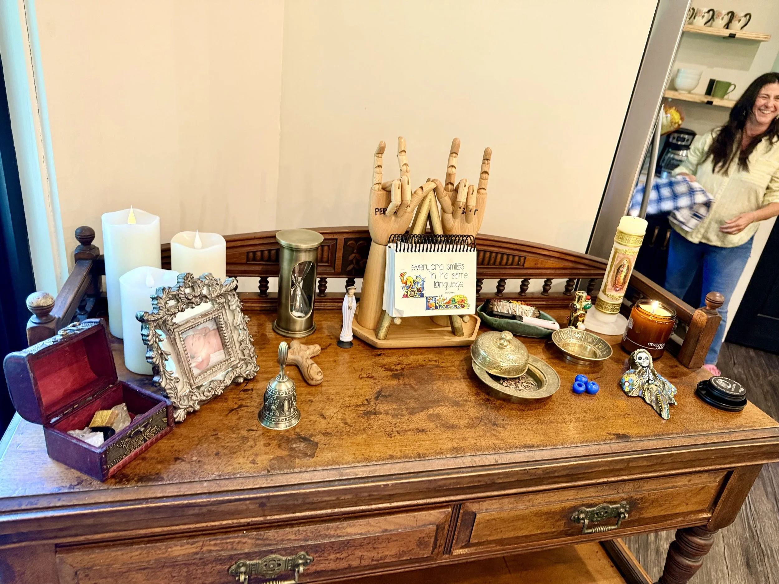 Community altar created by an advanced death doula training cohort at an in-person retreat, honoring shared experiences, intentions, and the journey of learning end-of-life care and death doula skills.