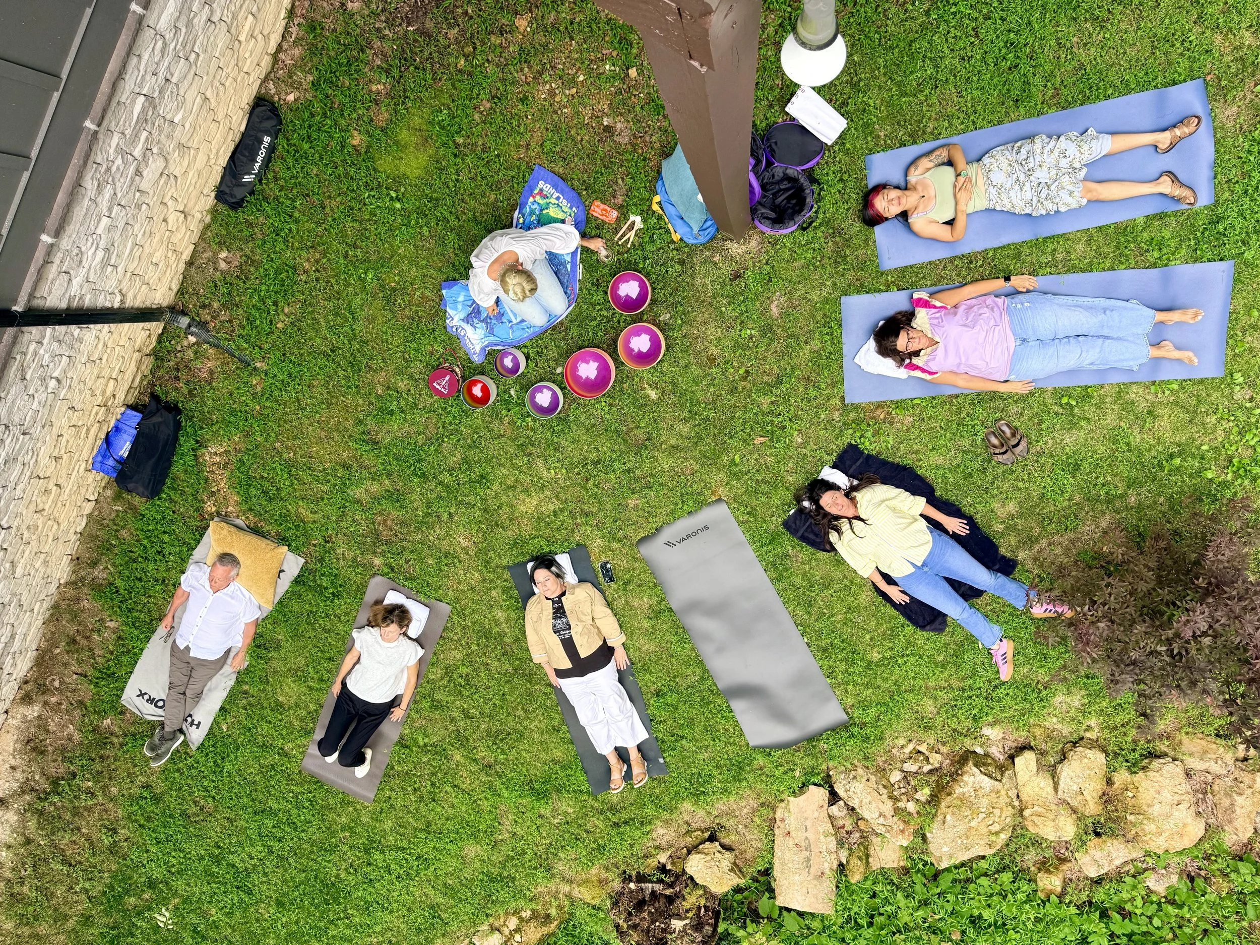 Advanced death doula training cohort participating in an outdoor sound bath practice in Franklin, Tennessee, as part of experiential learning in end-of-life care, grief support, and holistic doula practices.