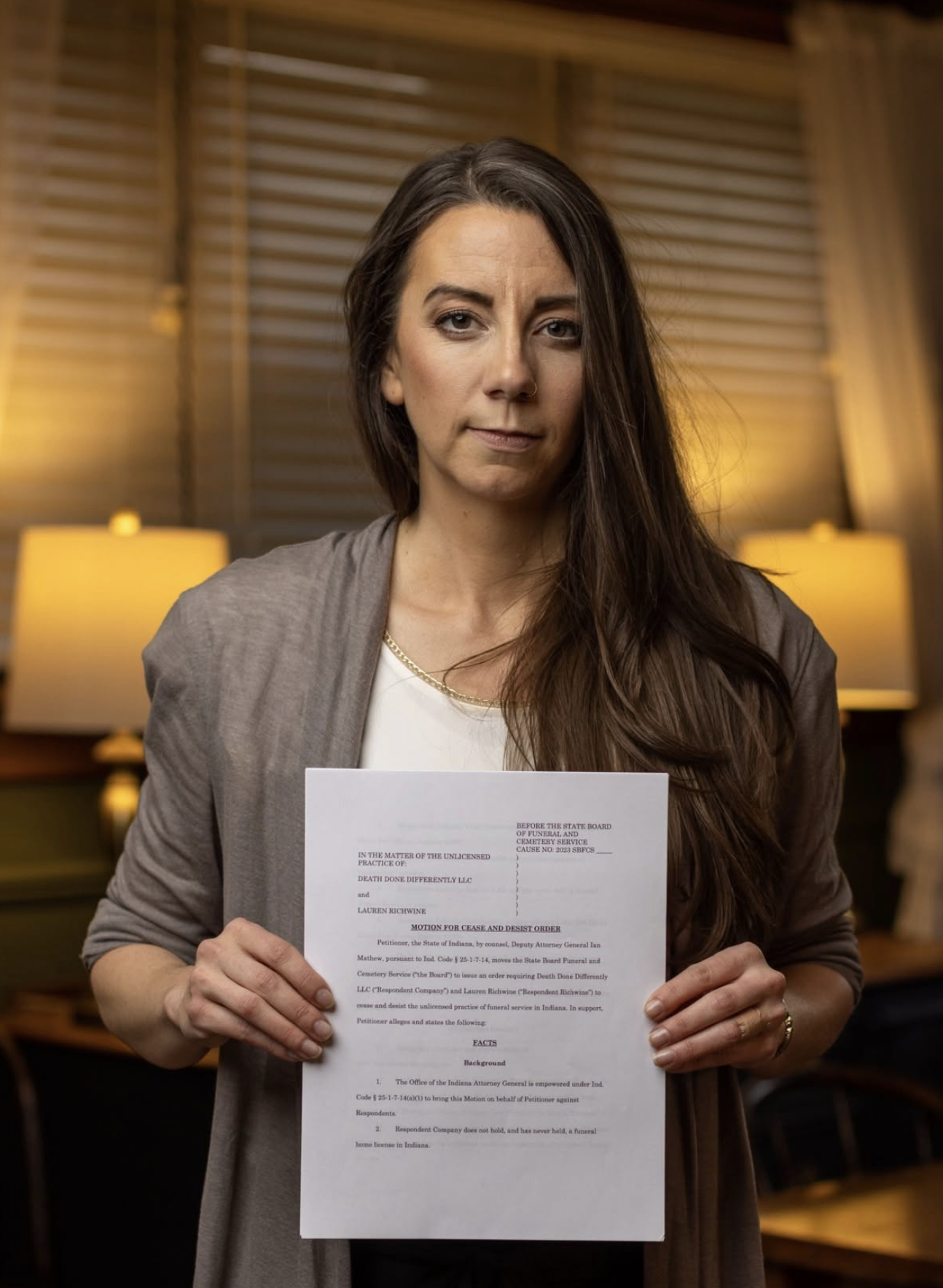 Lauren Richwine holding the cease-and-desist order that set her legal battle in motion.