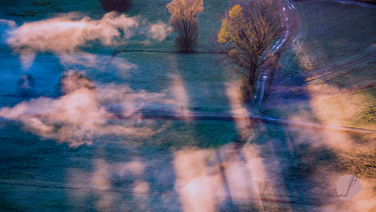 Cloud-dappled landscape evoking the mystical and sacred journey of the dying, with physical and spiritual transitions for death doulas.