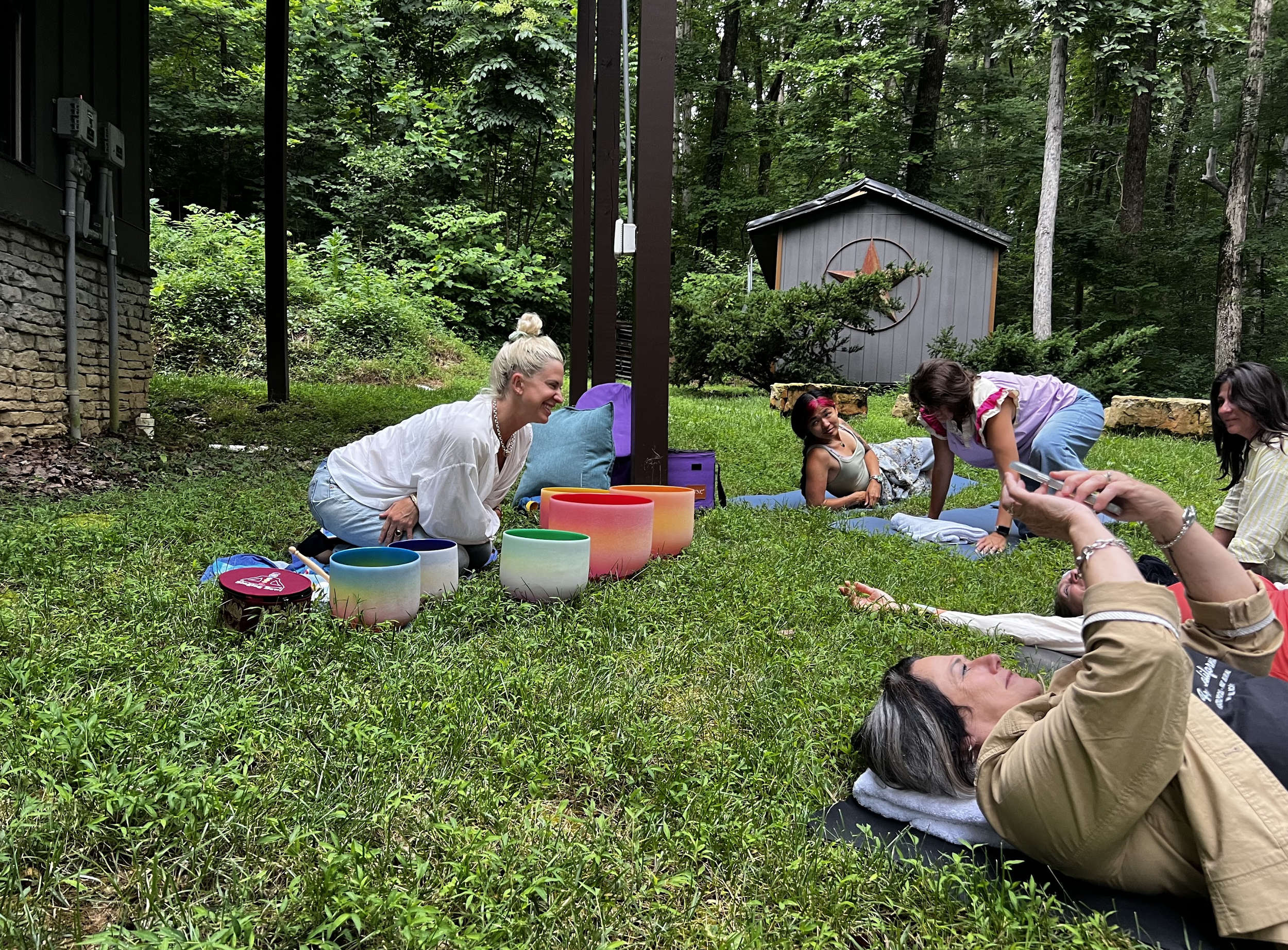 Gathering of death doulas at a hands-on retreat for trained death doulas doing continuing education with sound bowls for restoration and self-care.