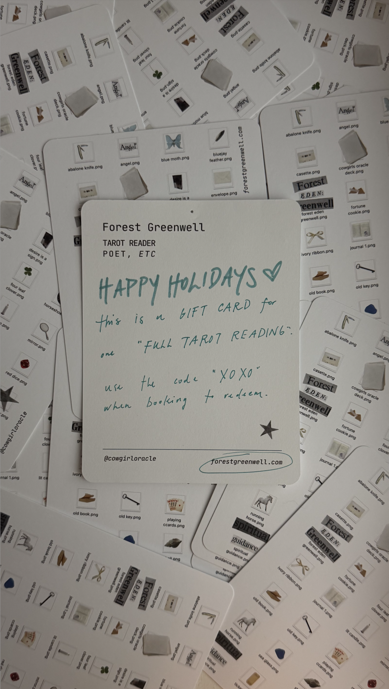 Sample gift card on a bed of postcards branded with Forest Greenwell stickers