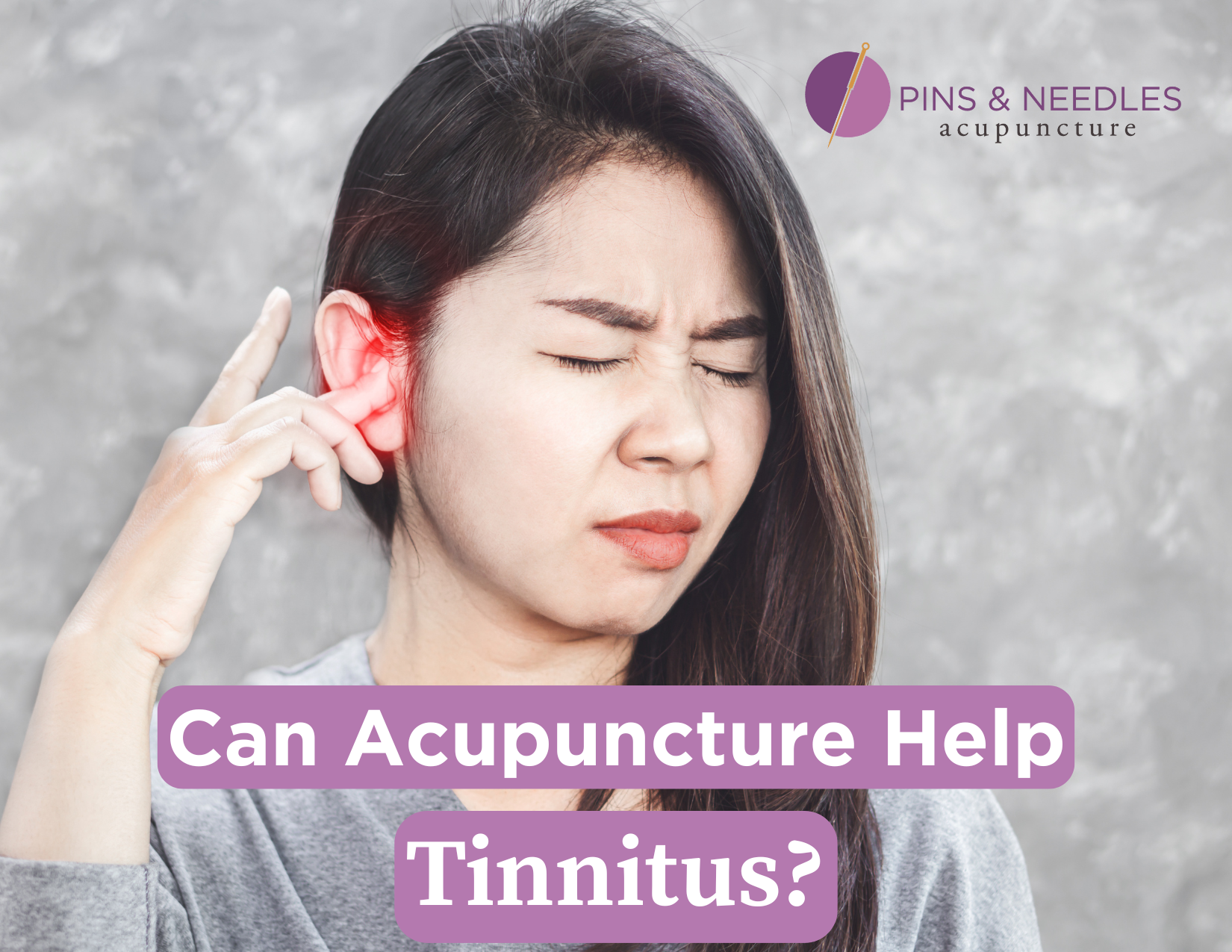 Woman experiencing tinnitus in her ears.