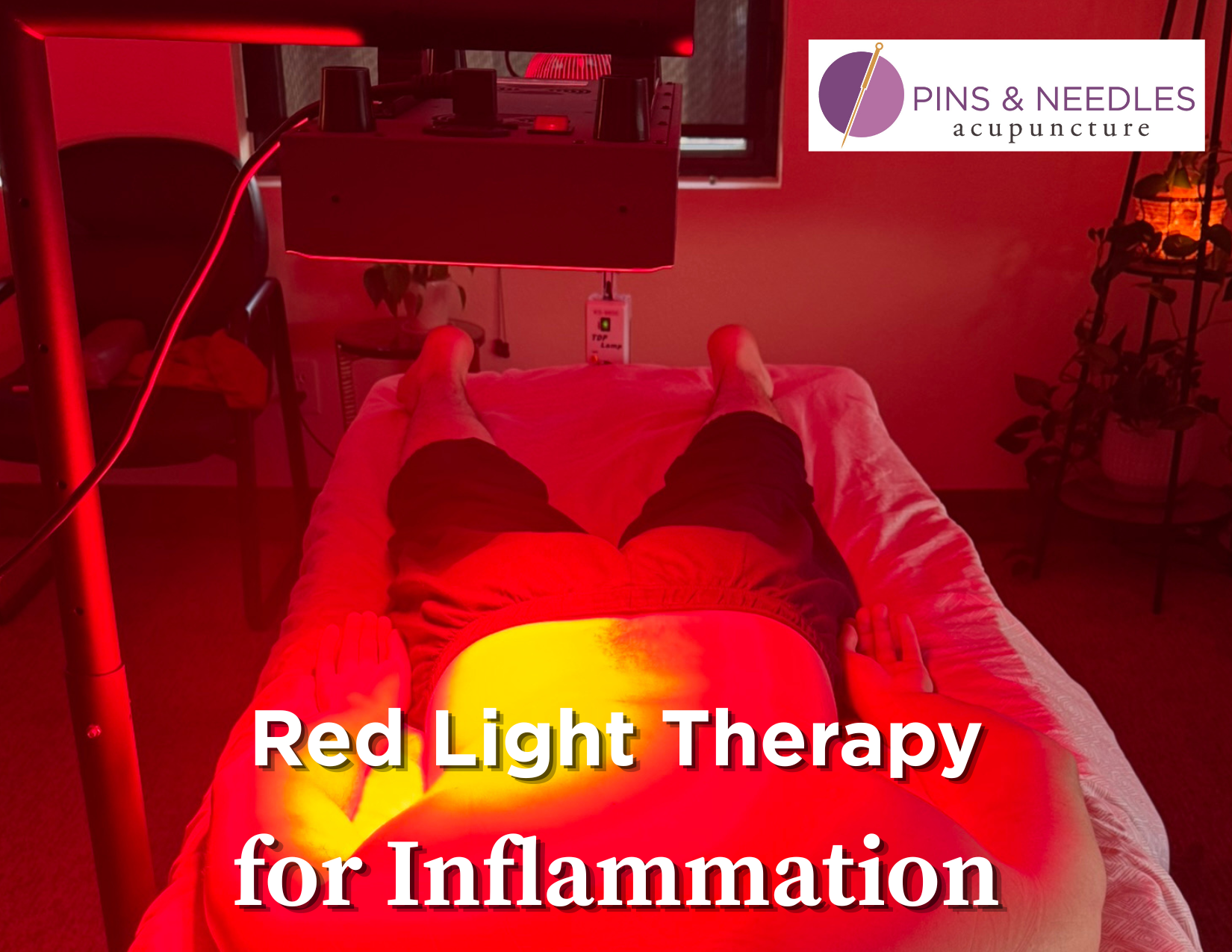 Person having red light on their back for back pain