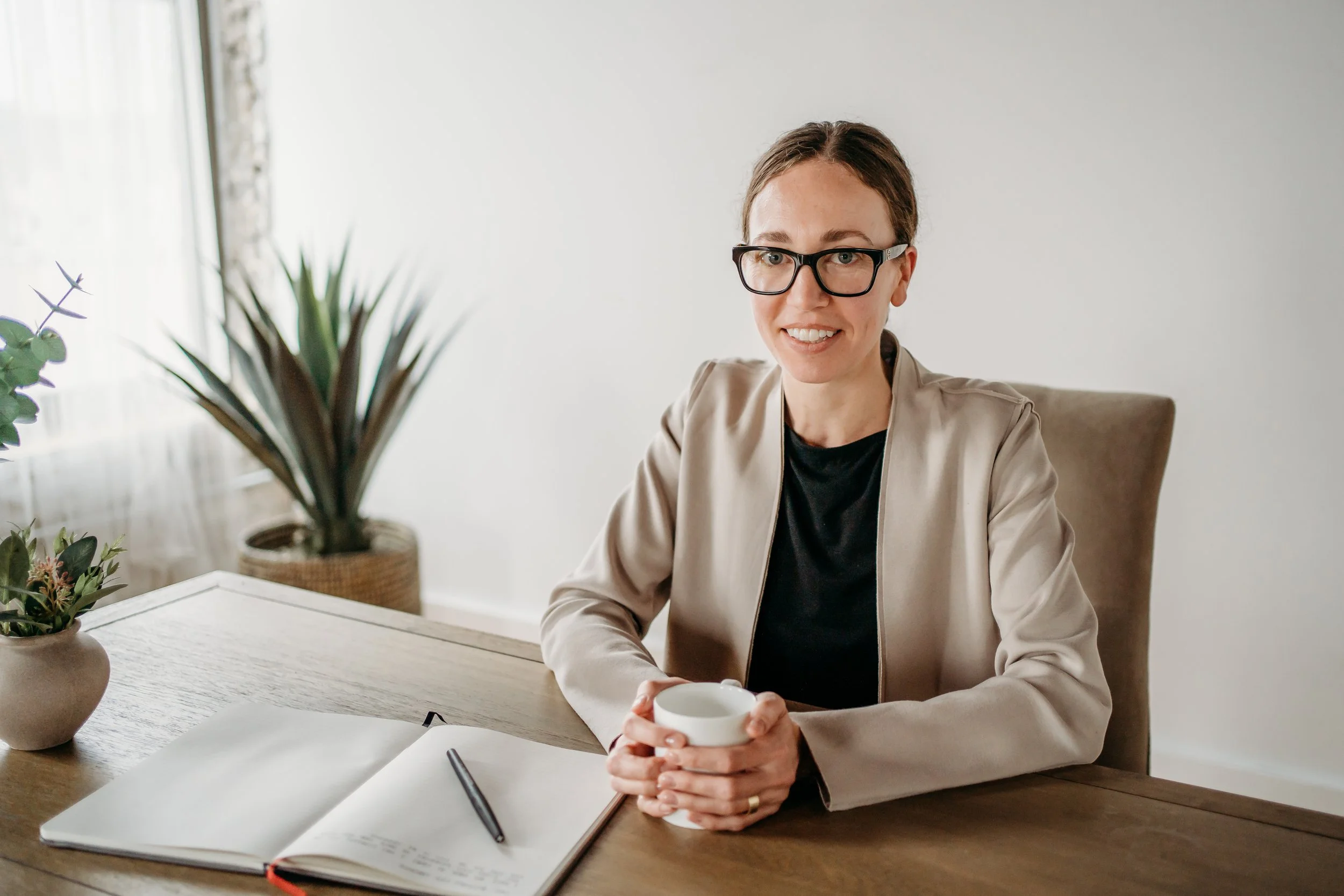Life Coach Mar at desk