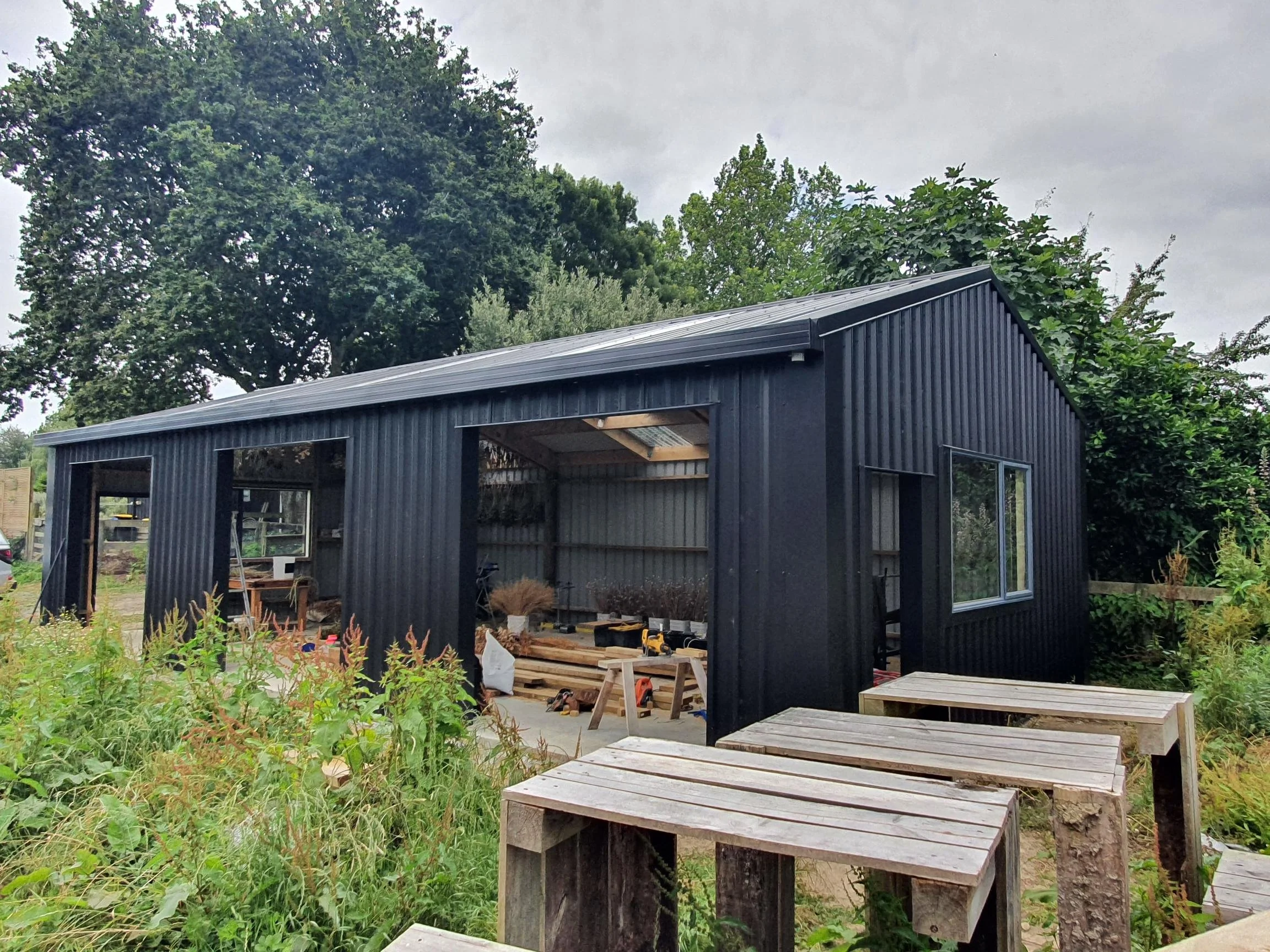 kit set shed, roofed and wall cladded.