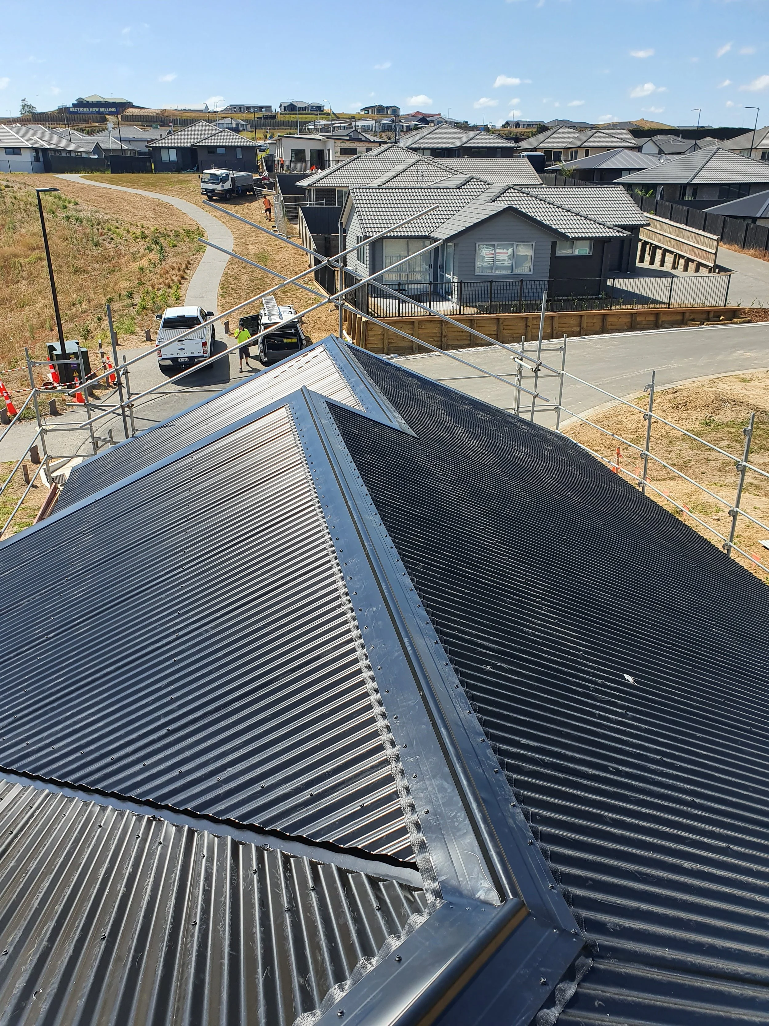 Corrogated long run roofing, with split gable design.