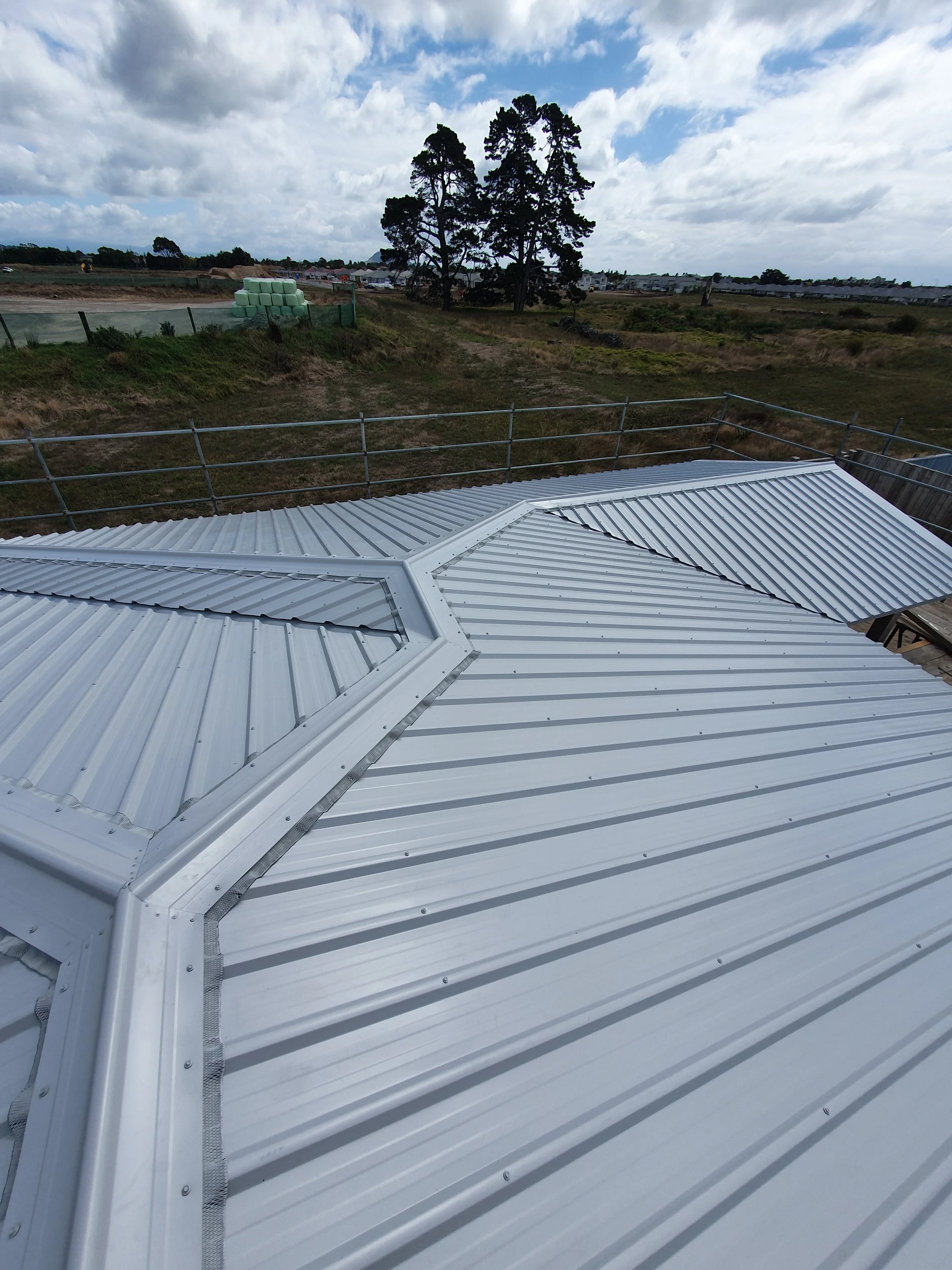 Styleline long run roofing profile on a hip and valley roof.