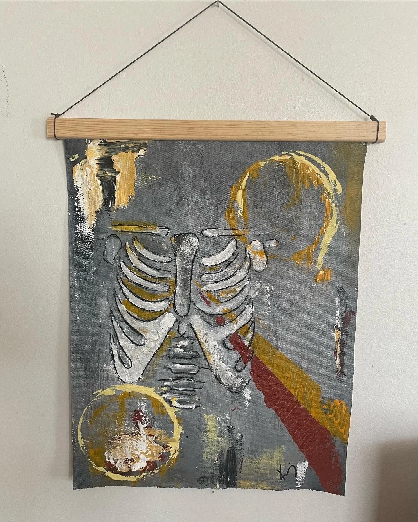 An abstract painting featuring a human skeleton with a lemon slice at the top right and bottom left corners, and a red and yellow diagonal stripe across the chest area.