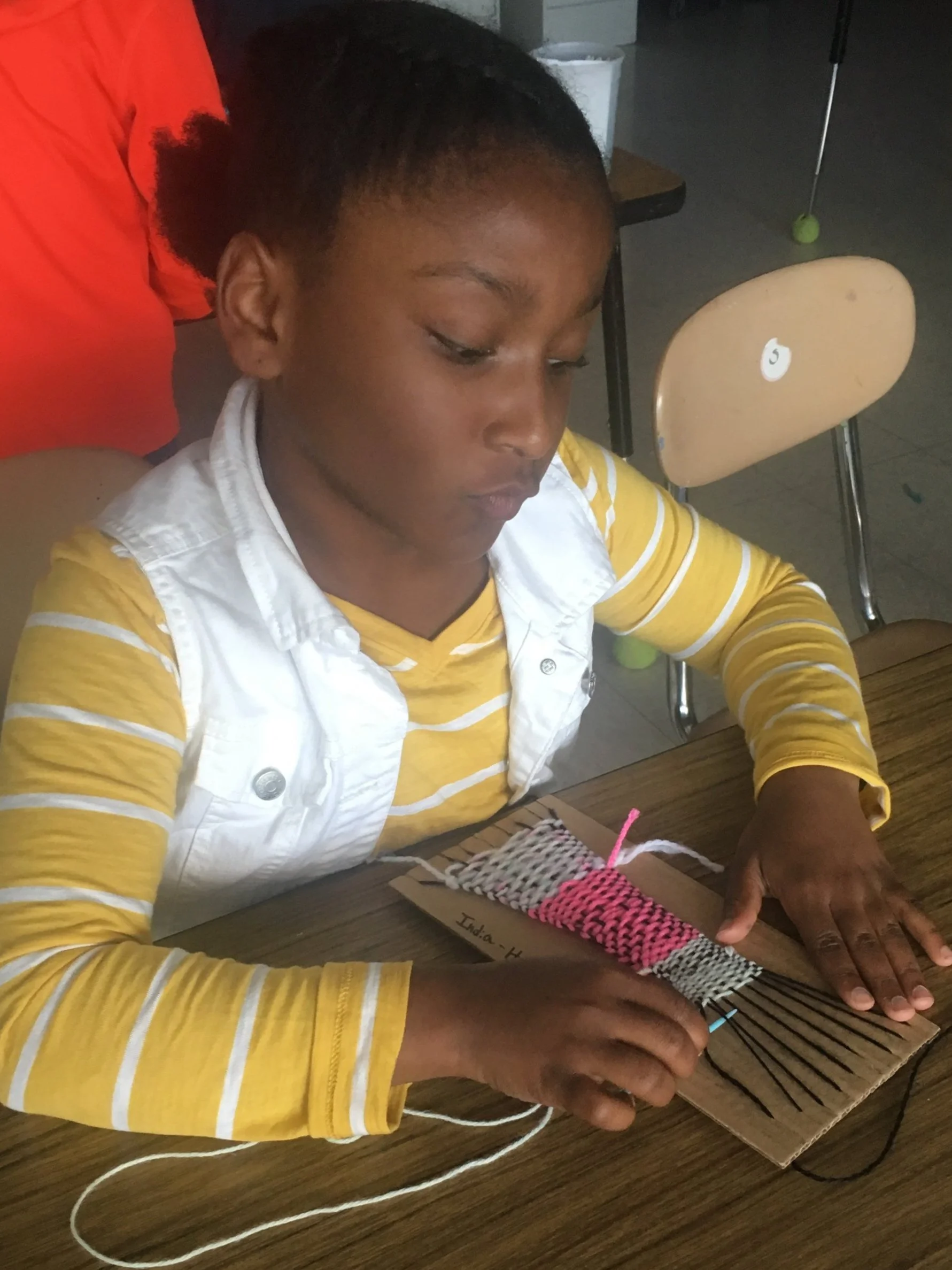 Hand weaving, cardboard loom
