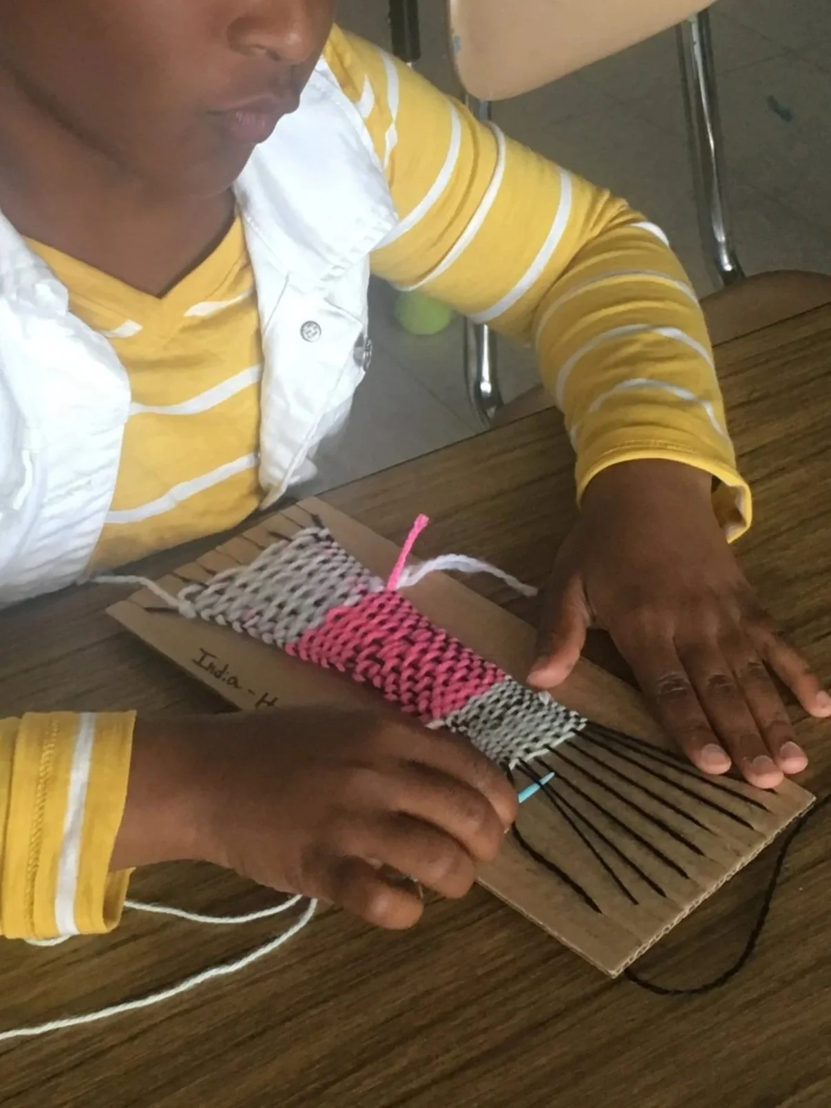 Hand weaving, cardboard loom