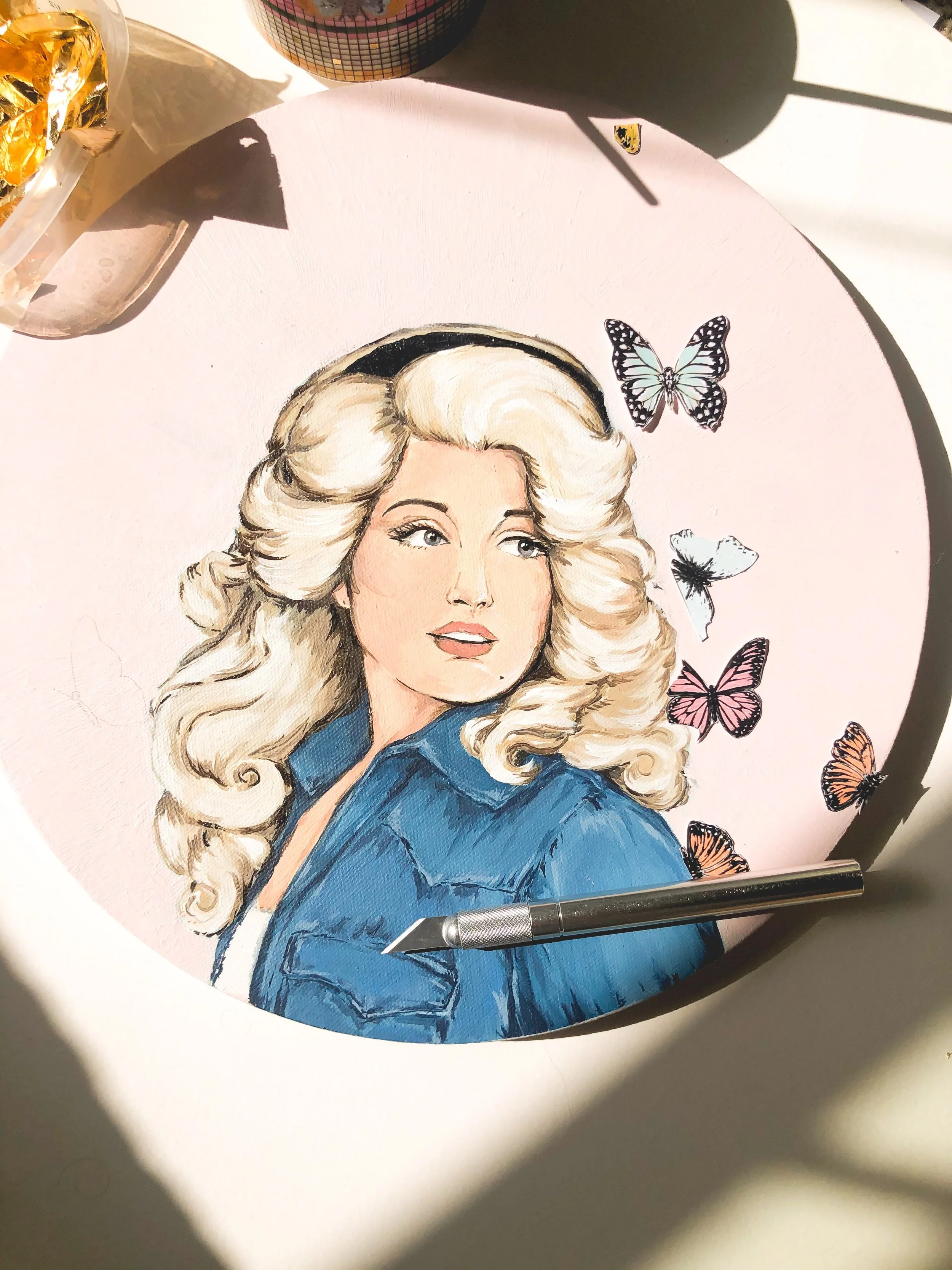 In 2019, I painted a piece of Dolly Parton covered in butterflies on the floor of my college apartment and posted it for a couple dozen Instagram followers, who at the time were pretty much just my best friends and family.

I had no idea how many peo