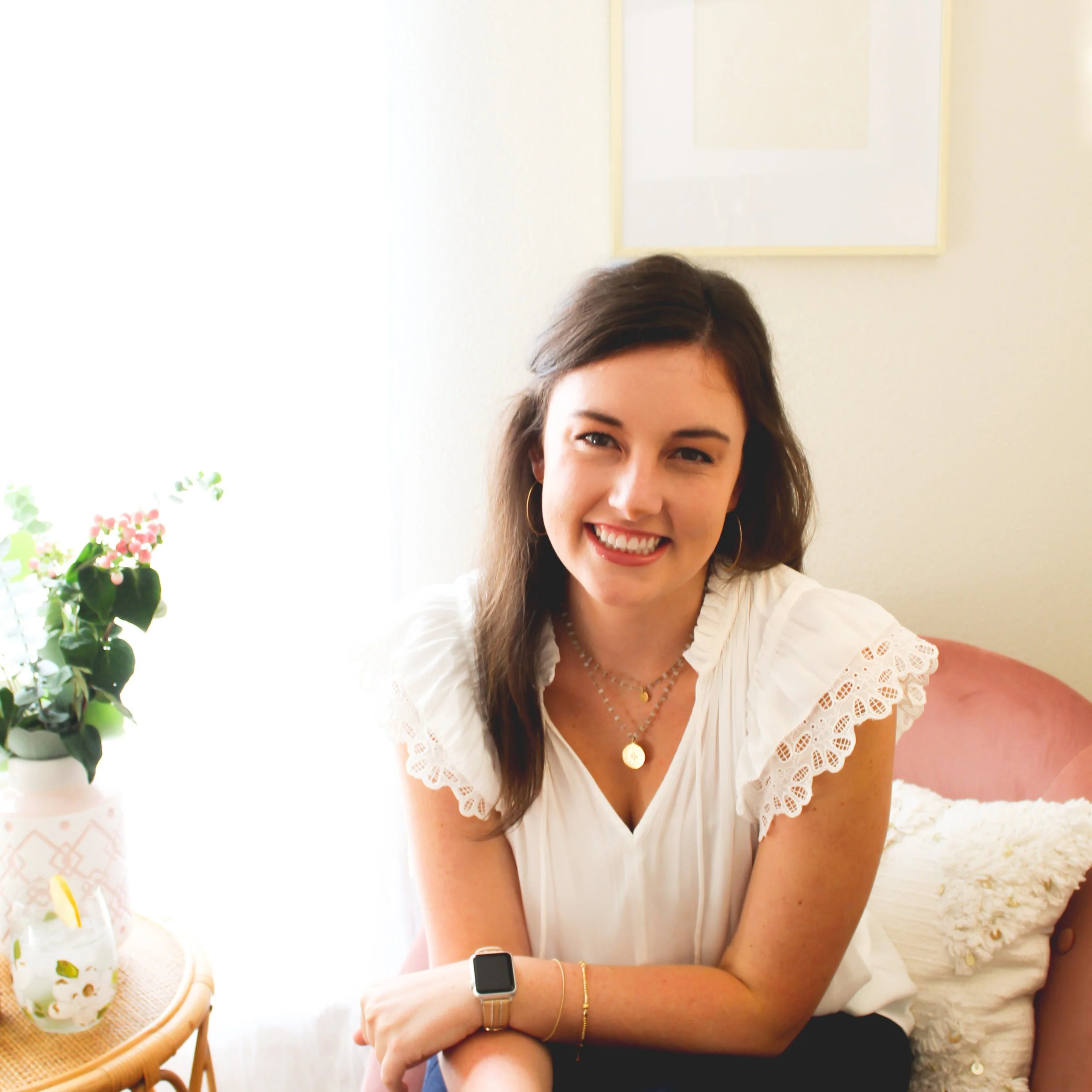 an image of the artist in the studio relaxing with her artwork. 