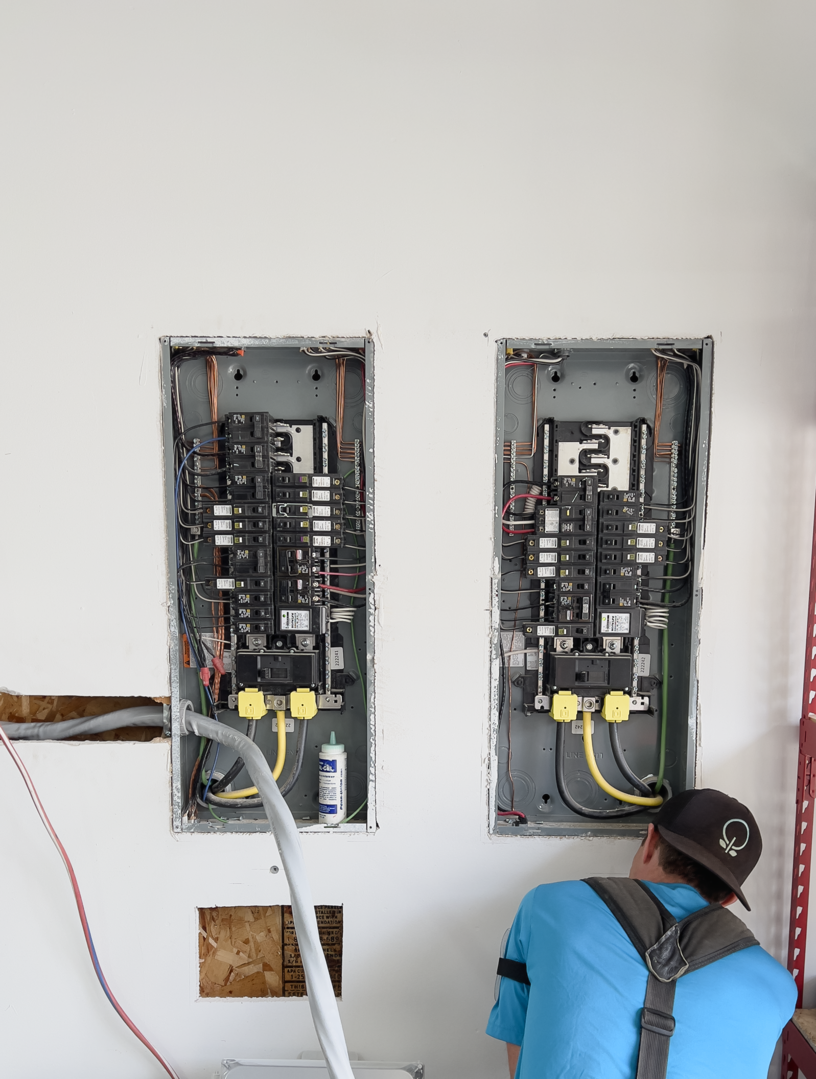 Blossom Solar electrician working on two service panel upgrades in Lake Stevens, WA