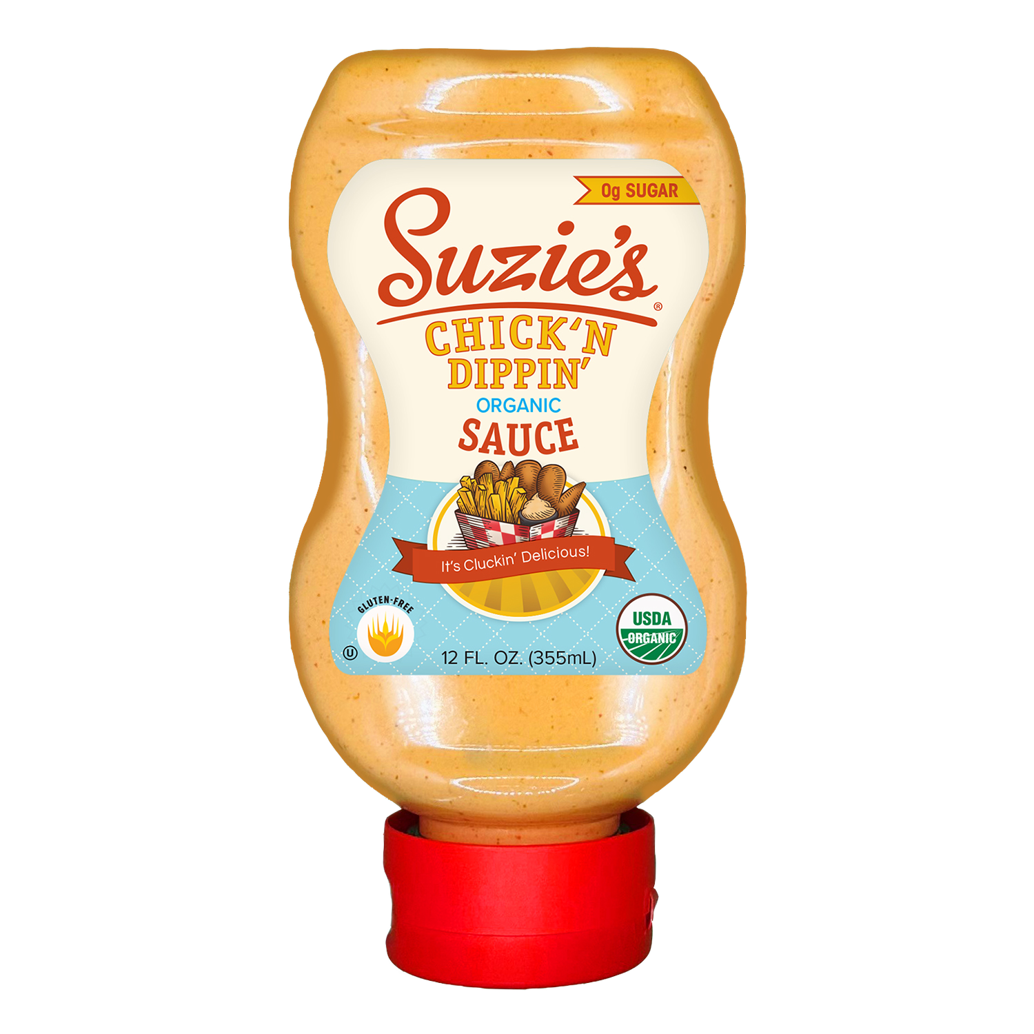 A bottle of Suzies Chick'n Dippin' organic sauce with a label indicating it contains no sugar, is gluten-free, and USDA organic. The label features a graphic of chicken and fries with the slogan 'It's Cluckin' Delicious!'