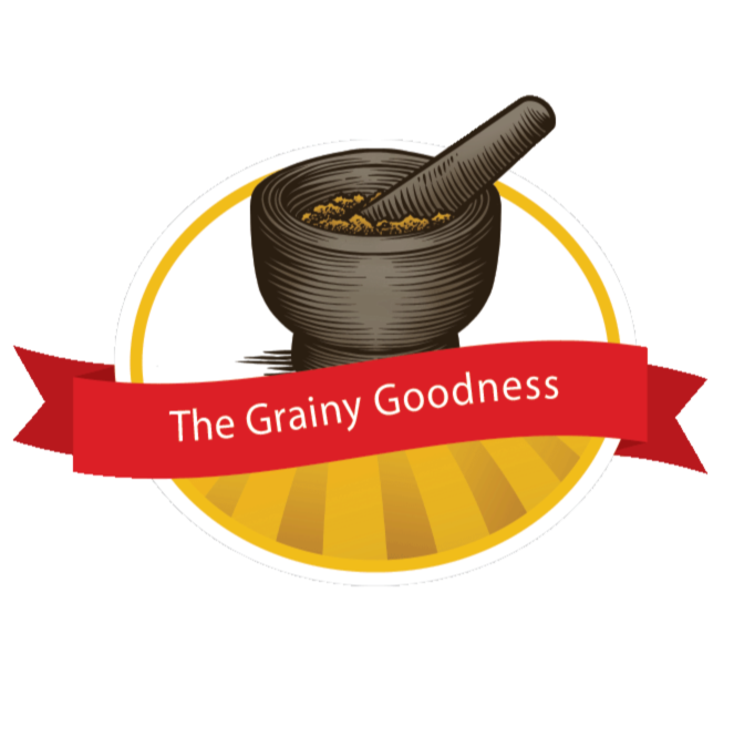 A logo featuring a mortar and pestle with a yellow grain-like substance, a red ribbon with the text "The Grainy Goodness," and a yellow and white circular background.