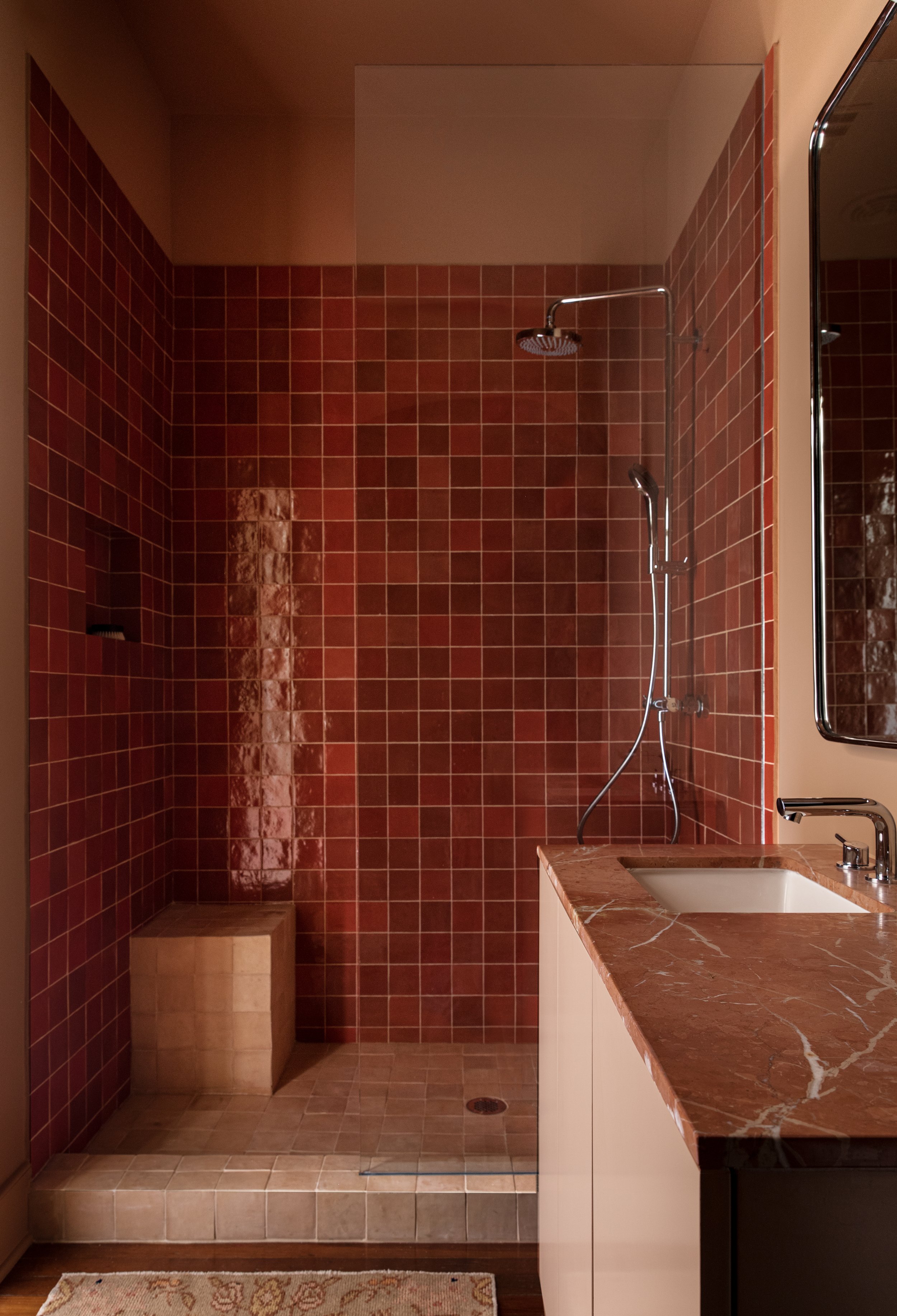  an orange and terracotta zellige tile contemporary modern and rustic eclectic bathroom interior design in houston texas 