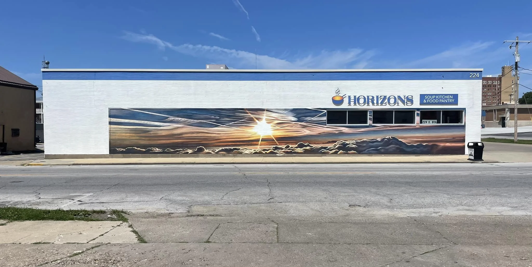 Horizon Mural on the east side of the building facing 8th St (front)