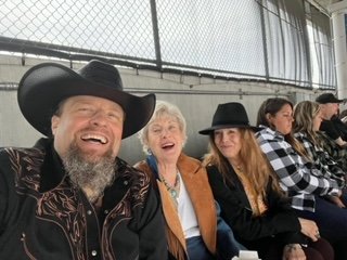 Rev, CiCi, and Mama Norine enjoy a fantastic event, their smiles radiating the joy of shared moments and cherished memories.