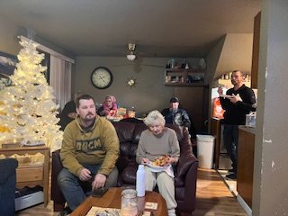 Mama Norian savored a greasy slice of pizza, each bite symbolizing the joy of shared moments. Cam's face lit up with pure happiness as he discovered his favorite music, while Paul went back for a second slice, relishing every bite as if it were a sma
