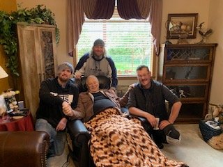Jesse, Cameron and JB posing, and receiving prayer with Chuck Robbins before a hike.