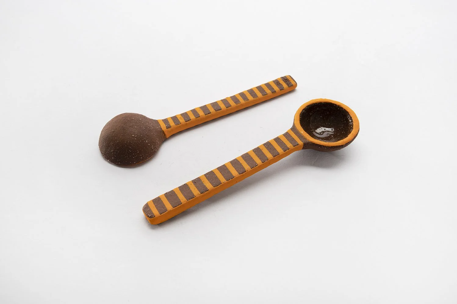 CC.05 / Hand-built (brown/orange) spoon / $20