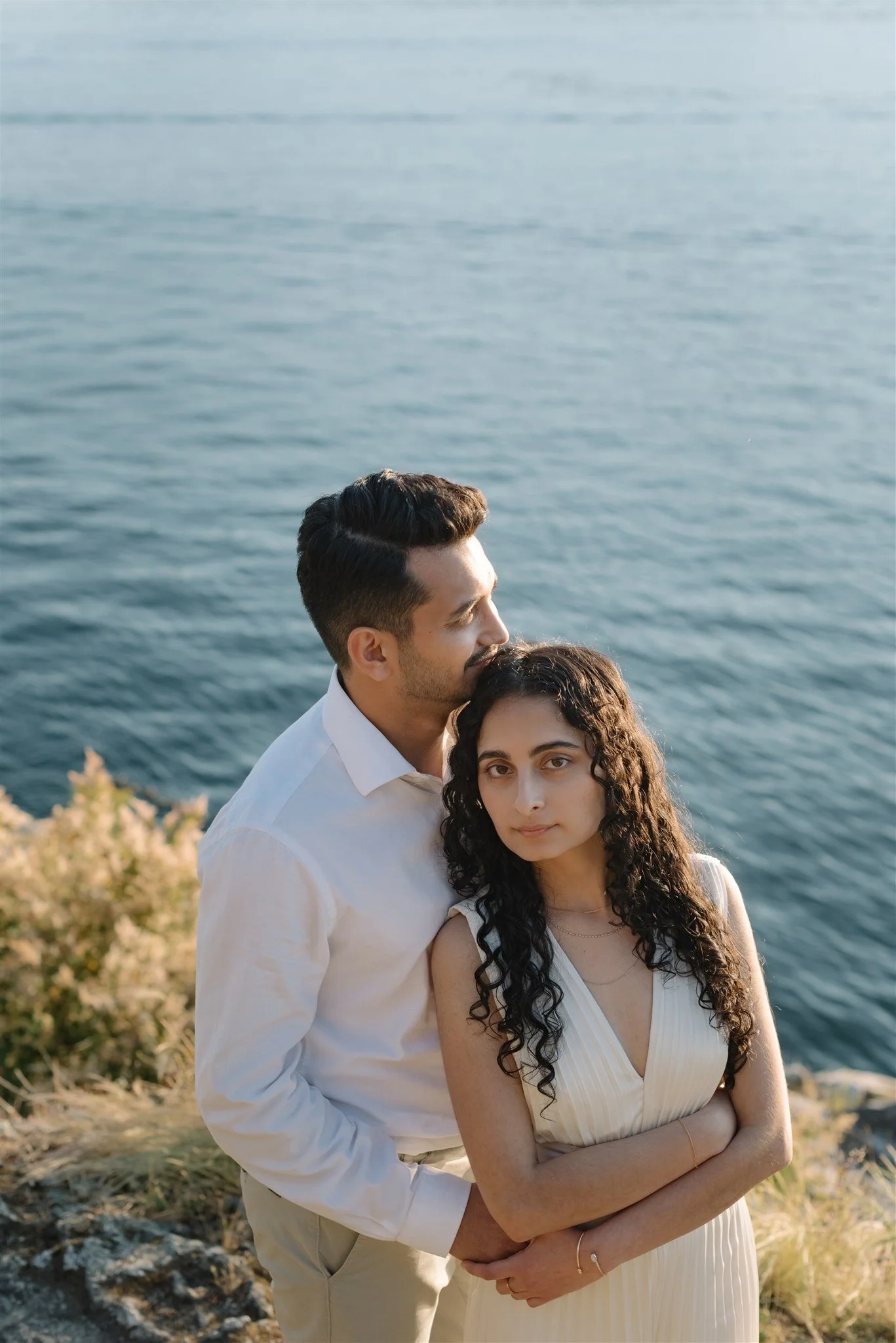 Engaged couple by the ocean at Whytecliff Park in West Vancouver