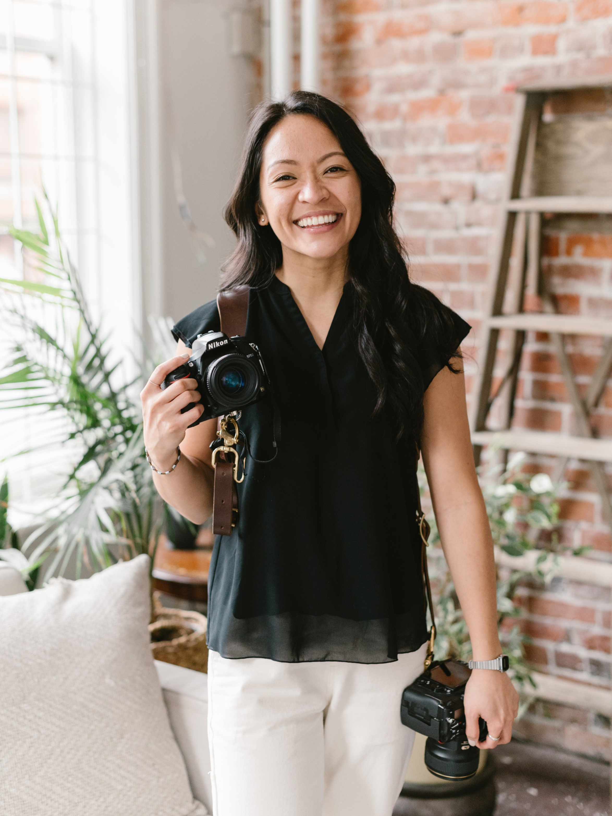 Valerie Gabrielle, Vancouver wedding photographer, holding a camera