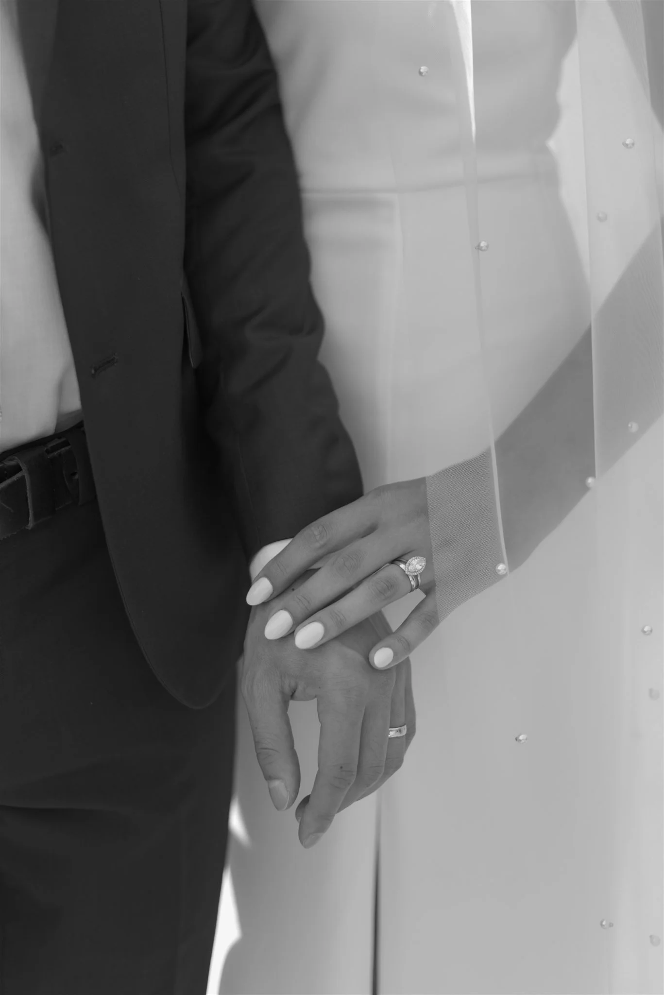 wedding couple's hands with rings showing