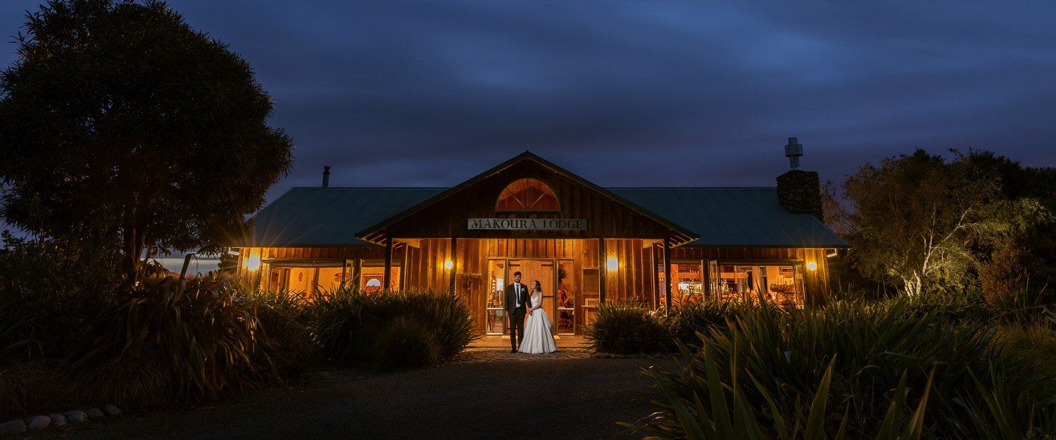 Couple standing at the front of Makoura Lodge wedding venue