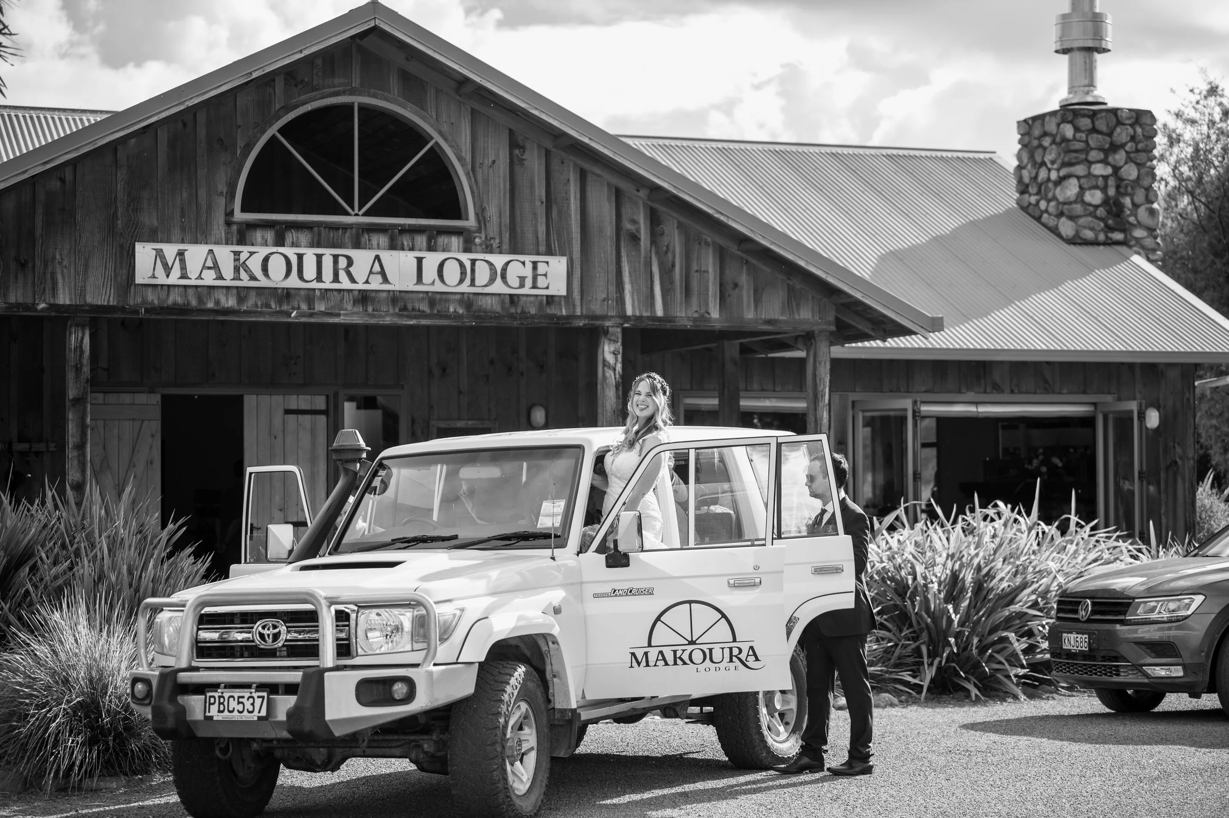 Group at Makoura Lodge socialising during a christmas function in the outdoor dining area