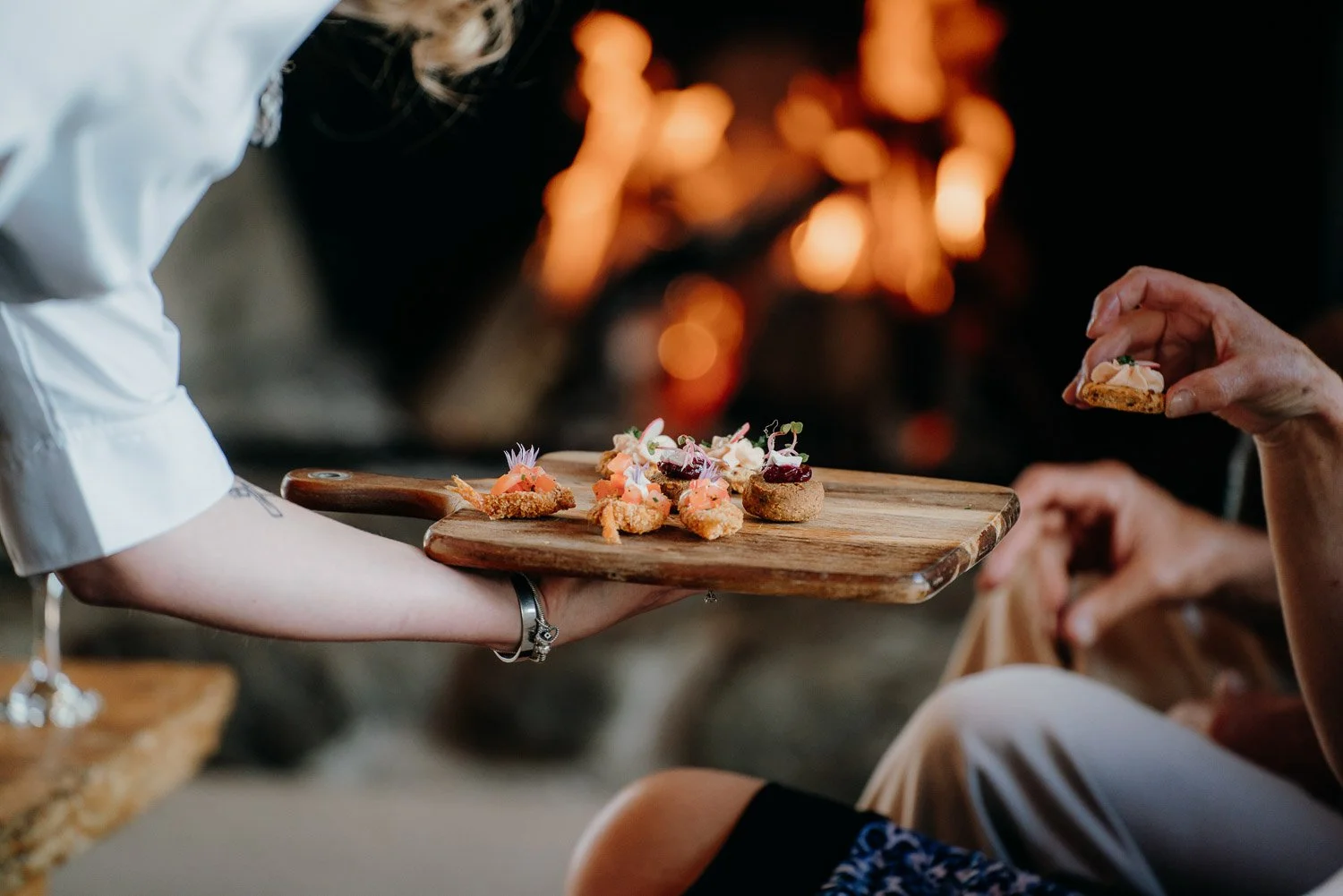 Makoura Lodge waitress handing out canapes at a christmas party
