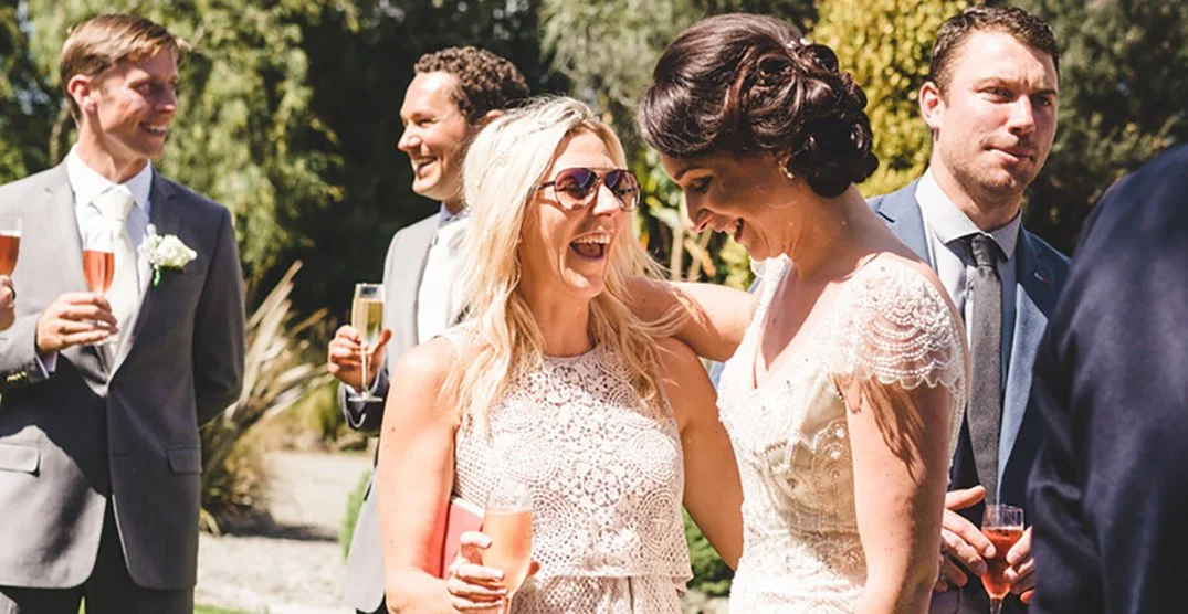 guests drinking bubbly at at wedding ceremony at Makoura lodge wedding venue