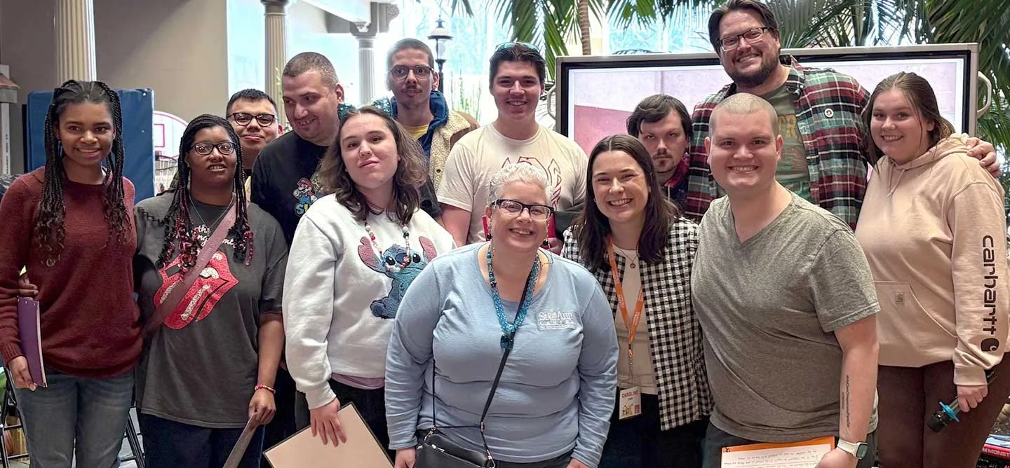 Brilliant Connections participants, mentors, and staff gather for a group photo during a community-building event at St. Ann Center.